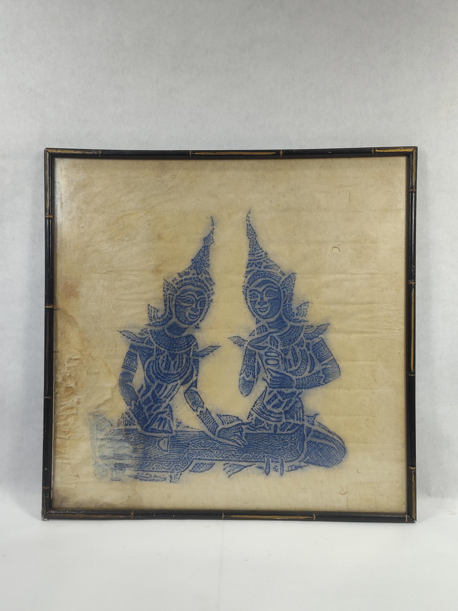 Blue Thai Temple Rubbing on rice paper: Shows some condition on lower left but still displays well, in a Bamboo frame. 20.5in x 20.5in.