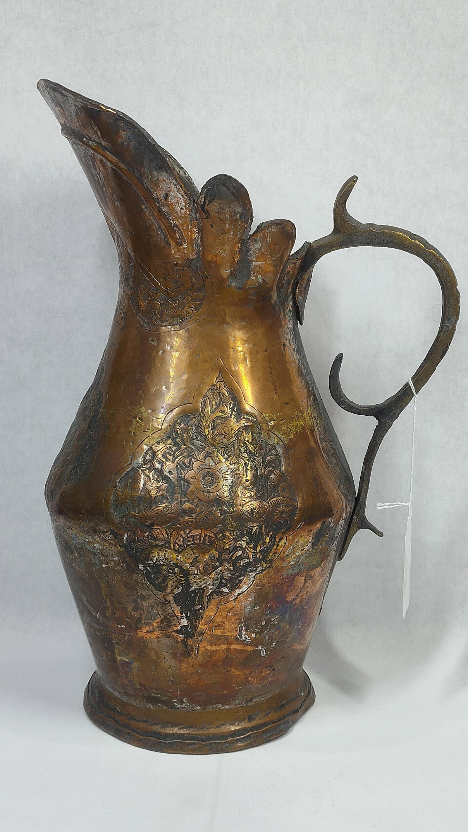Hammered Copper Persian Ewer: Scalloped edge with serpent and bird motifs. 16 inches tall. 