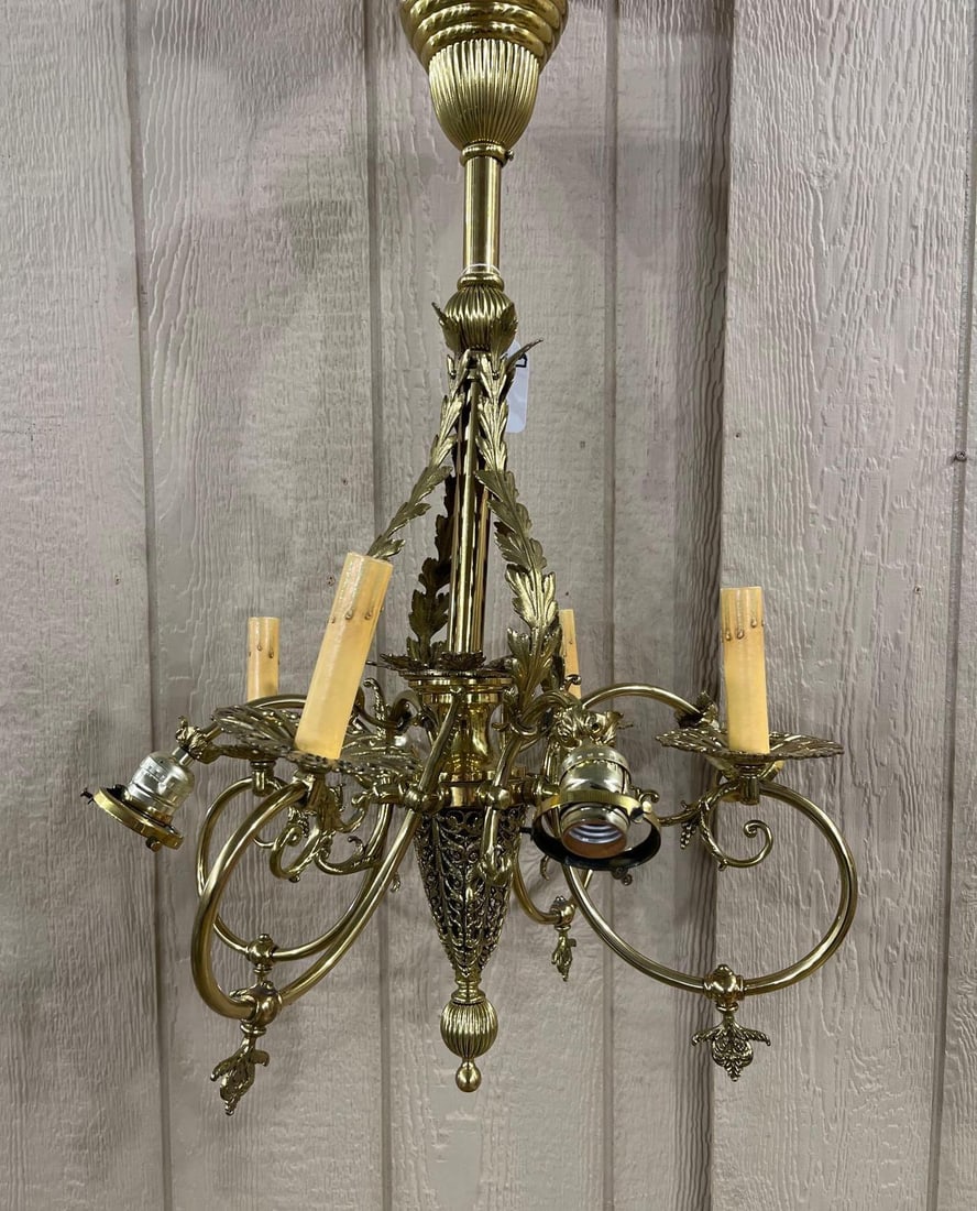 Art Nouveau Brass Chandelier: An intricate openwork bottom with leaf design, one shade is missing. 25 inches 