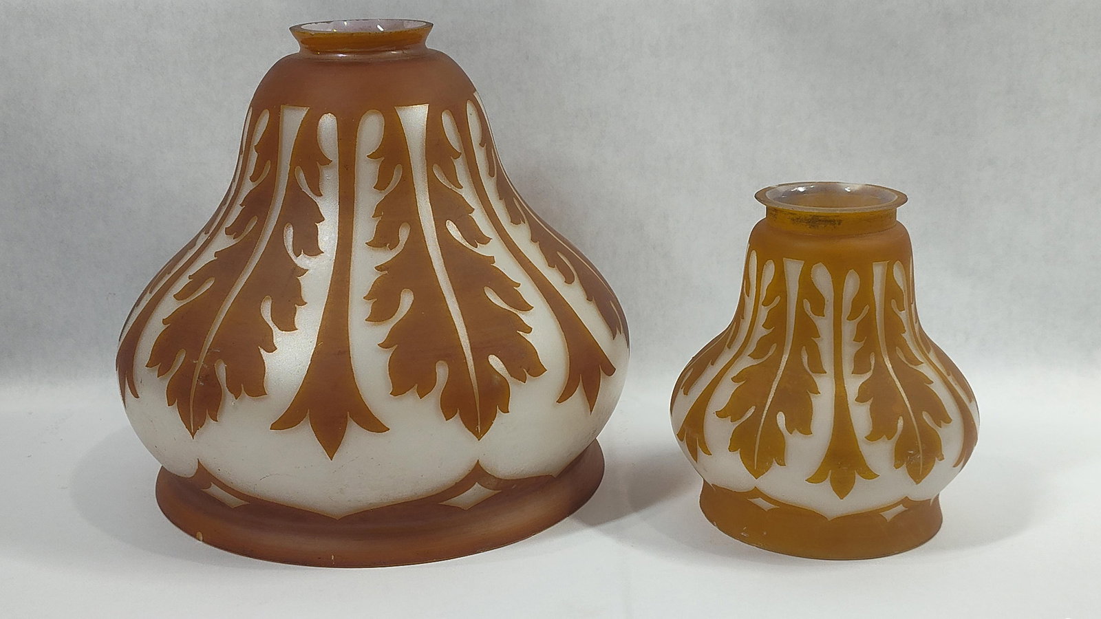 Art Nouveau Cameo Art Glass Shades: Both have a 2 inch fitter. With a acid etched foliage patter and gold and cream shades. 5 and 8 inches. 