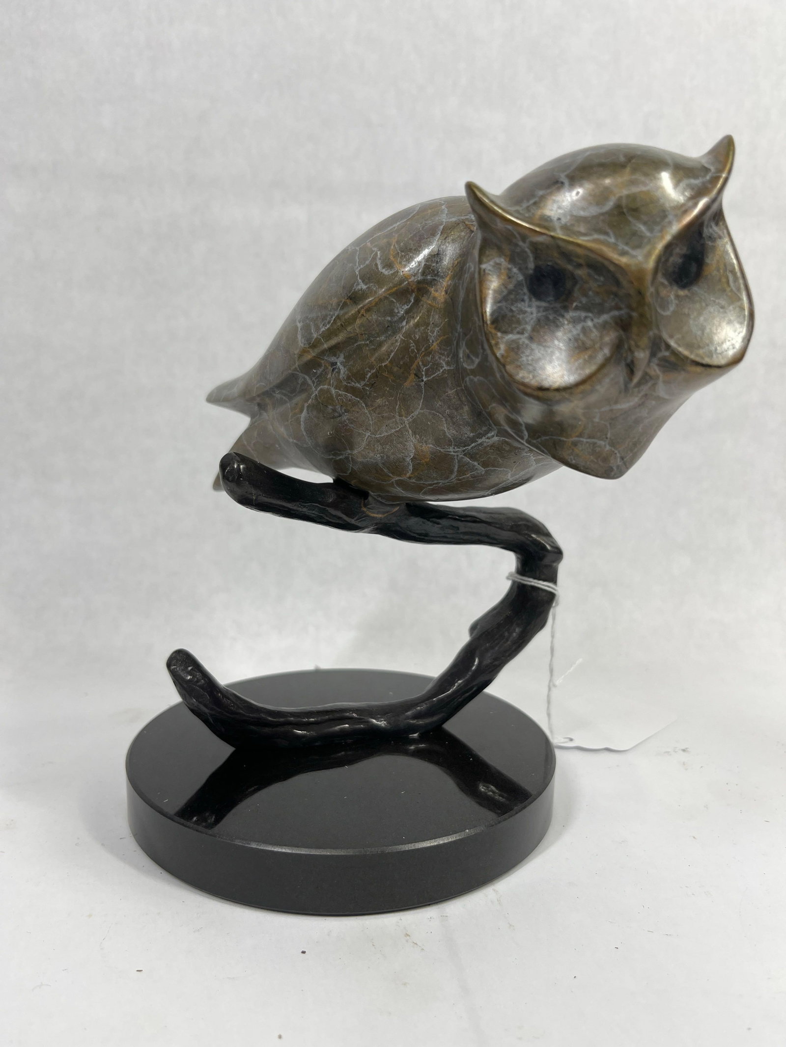 SPI Brass Owl on Branch: This brass marbled owl is perched on a branch, with a steady heavy base. Hand sculpted. 8.5x8.5x5.5. 