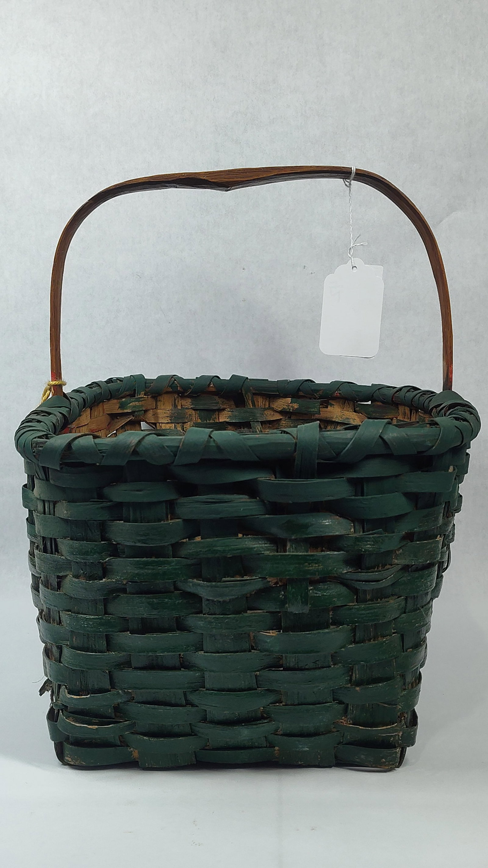Antique Hunter Green Basket: Hand woven with a painted green bottom and bent wood handle. 16x12