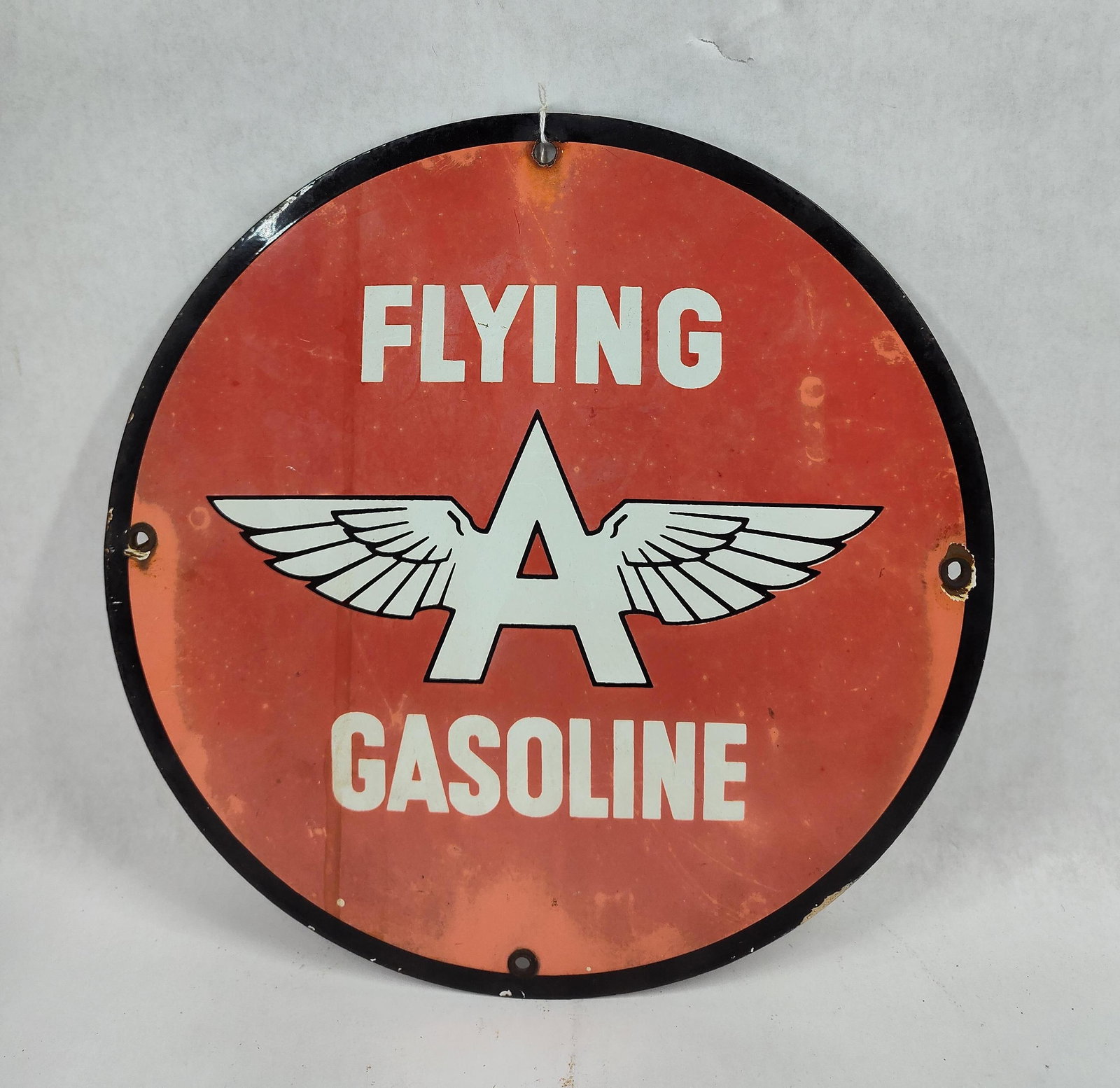 SSP Reproduction Flying A Gasoline sign: 1-sided porcelain with fading. 11.75in diameter.