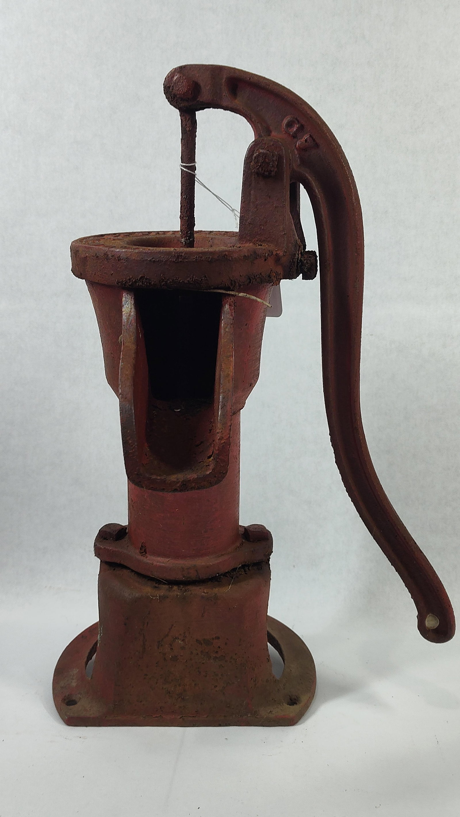 Deming Co. No. 2 Antique Cast Iron Pitcher Pump: This is a manual hand-operated pitcher pump manufactured by the Deming Company of Salem, Ohio. The pump is constructed of heavy cast iron and features a weathered red painted finish. The top rim of
