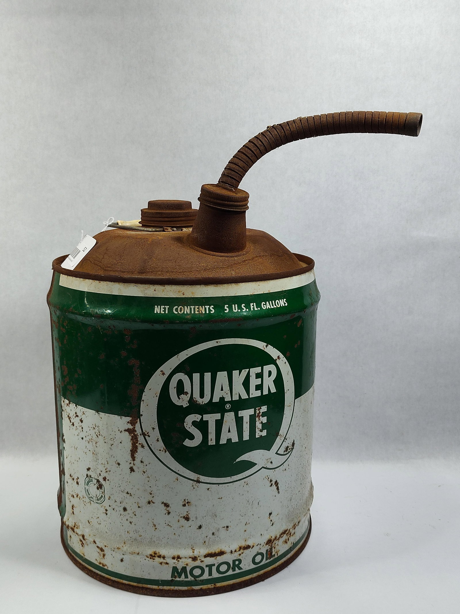 Quaker State 5-Gallon Motor Oil Utility Can: This is a5-gallon motor oil dispensing utility can from the Quaker State Oil Refining Corporation. The vessel is constructed of lithographed steel and features a flexible metal swan-neck spout and a w
