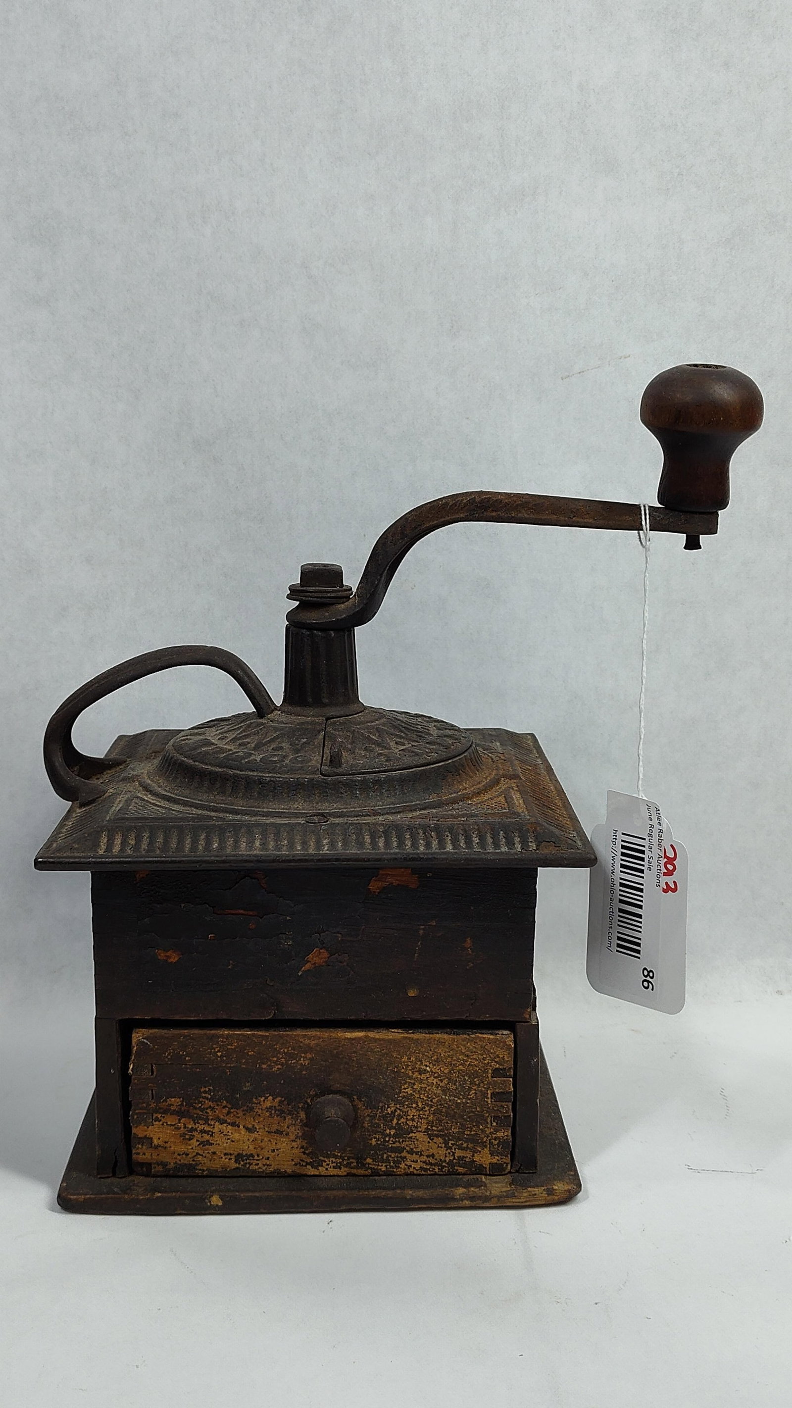 Antique Arcade Manufacturing Co. Cast Iron and Wood Coffee Grinder: This is an antique hand-cranked coffee mill manufactured by the Arcade Manufacturing Company of Freeport, Illinois. The item features a box-style construction with a dark-stained wooden base and a