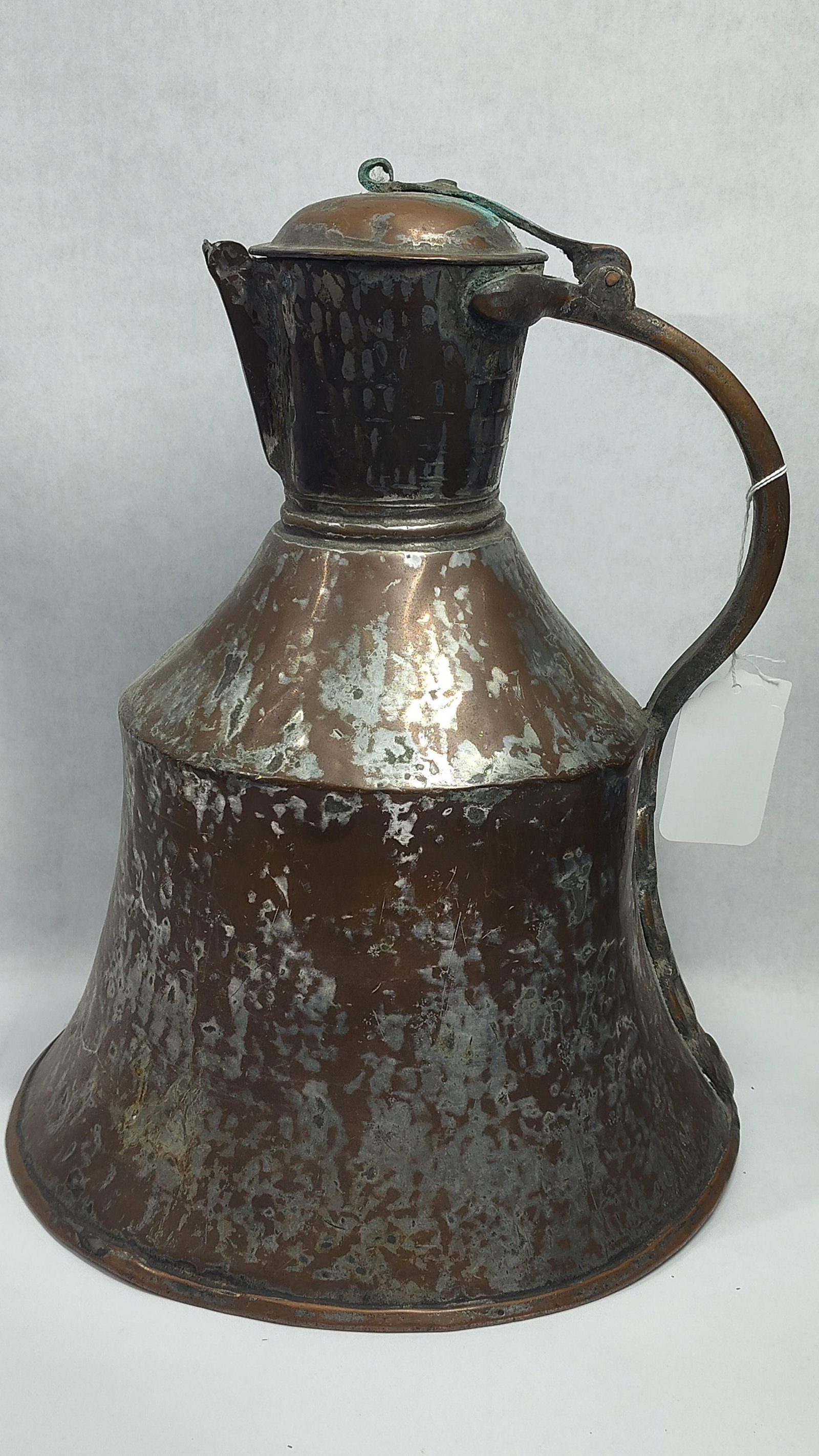 19th Century Ottoman Style Bell-Shaped Tinned Copper Water Jug with Hinged Lid: This antique 19th-century water jug or ewer is designed in a traditional Ottoman style with a flared bell-shaped base. The vessel is constructed from hand-hammered copper with a visible martel? textur