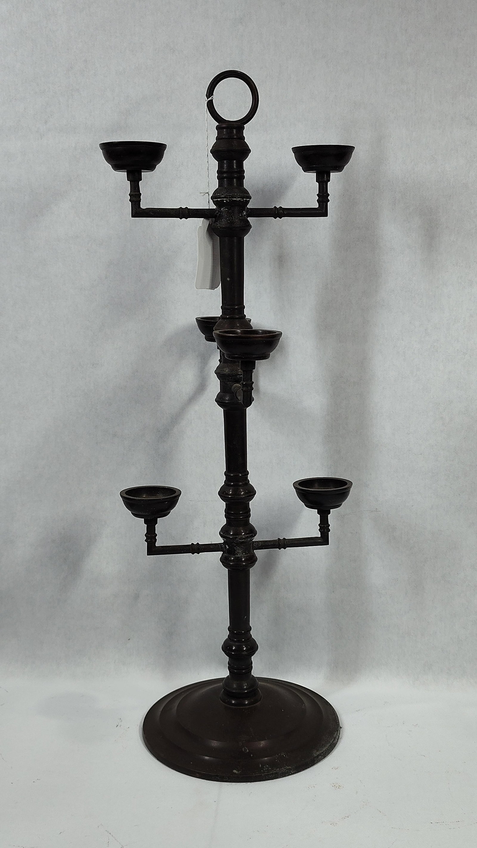 Neoclassical Style Six-Light Tiered Cast Metal Floor Candelabrum: A floor-standing six-light candelabrum featuring a tiered design, constructed from cast and turned metal with a dark brown to black patinated finish. The central vertical shaft is detailed with multip