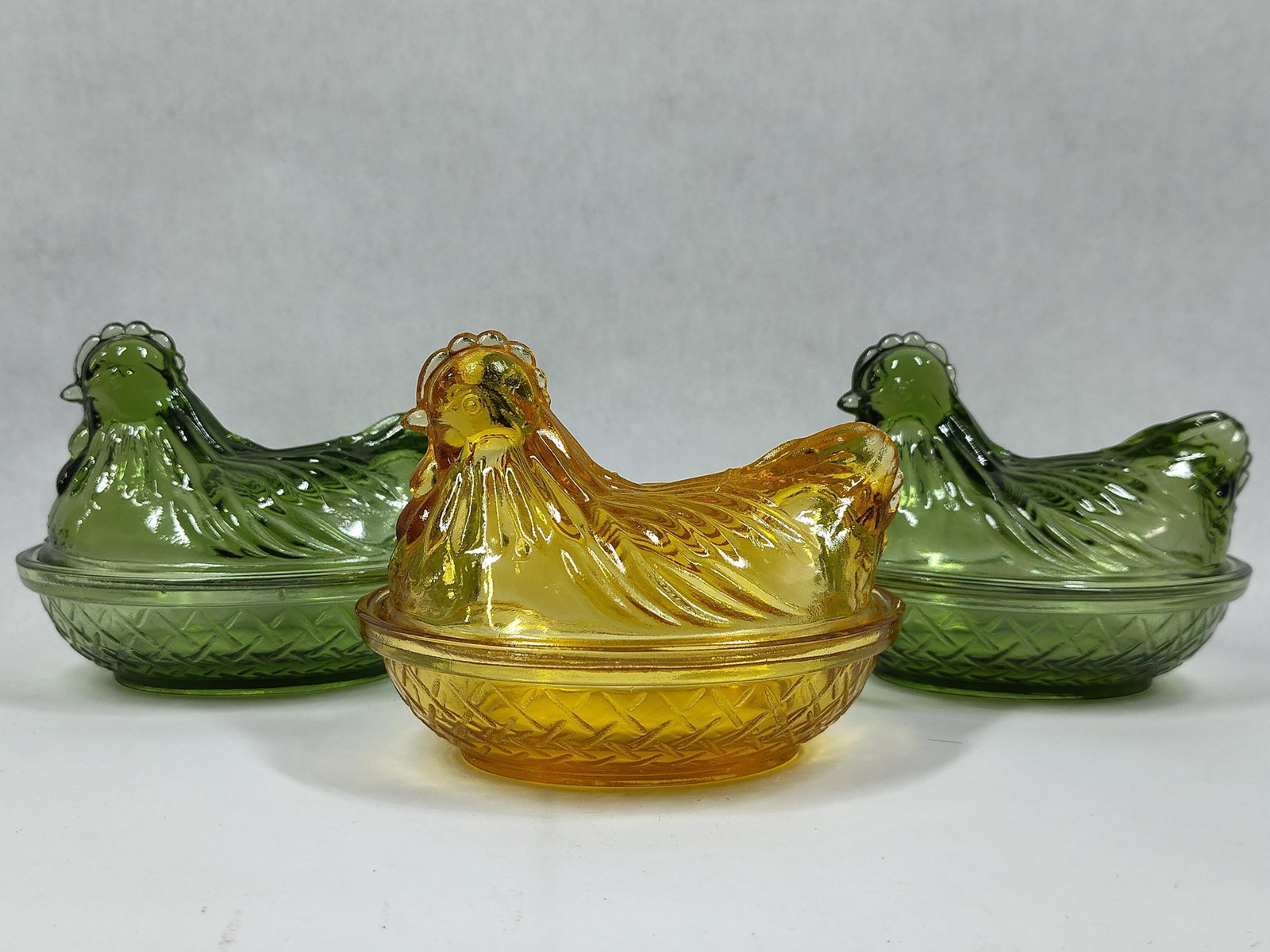 A Trio of Indiana Glass Hen on Nest Covered Dishes in Green and Amber (1 of 8)