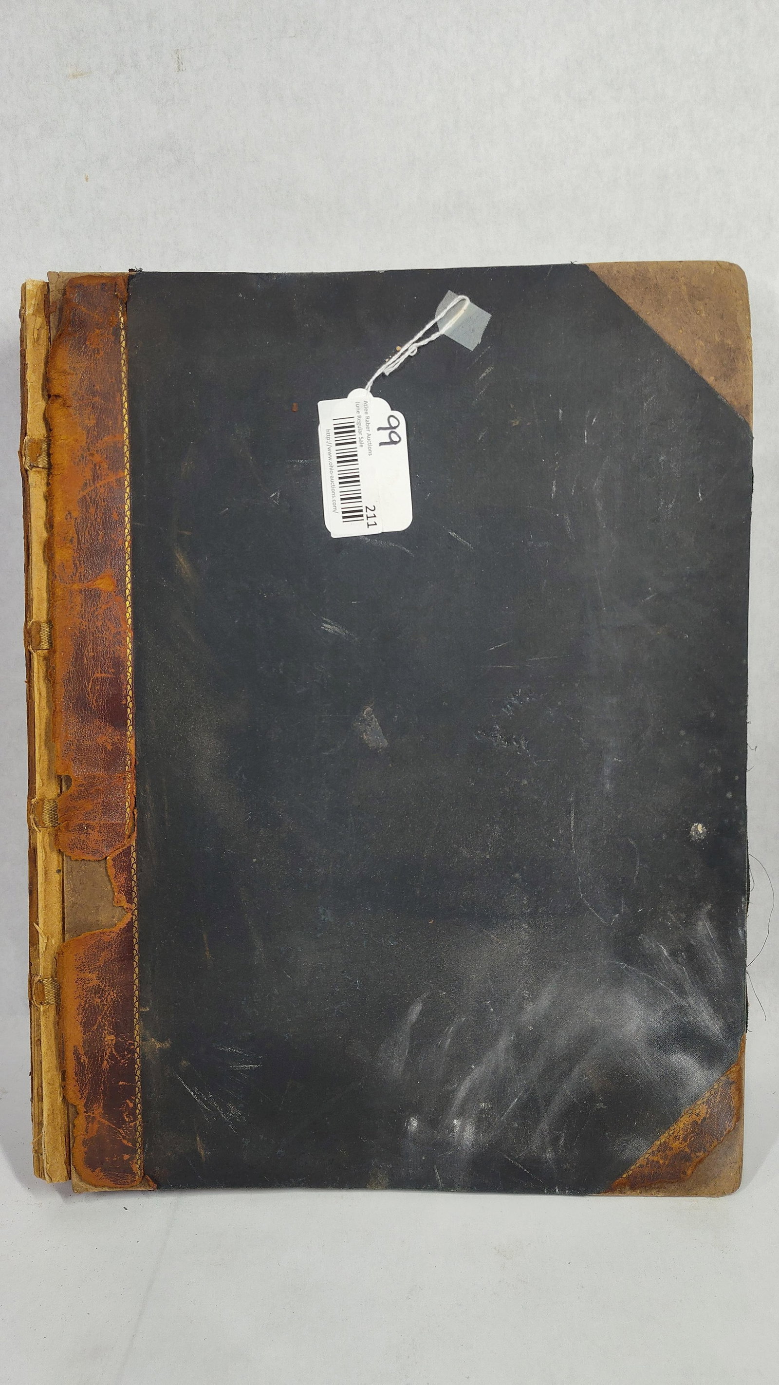 Late 19th-Century Folio Scrapbook of Newspaper Clippings and Chromolithographs. Circa 1891-1895.: A large late 19th-century personal scrapbook of the commonplace book style, folio in size. The volume is bound in a half-leather binding with black cloth-covered boards and leather-reinforced