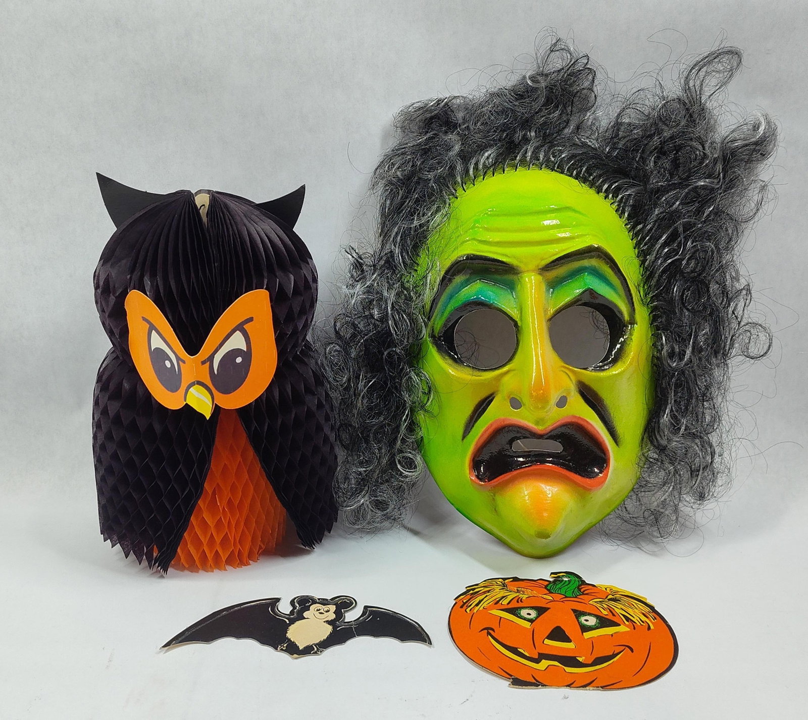 An Assortment ofHalloween Decorations including Ben Cooper Witch Mask and Honeycomb Centerpiece (1 of 5)