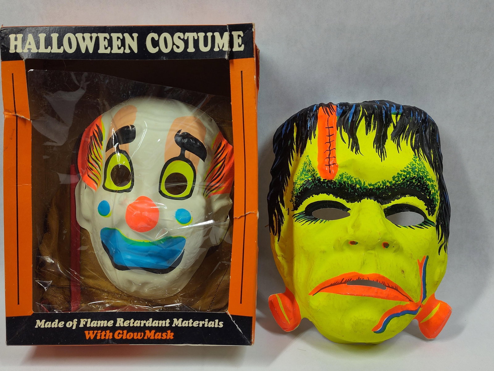 TwoHalloween Masks Including Boxed Bland Charnas Clown Costume and Collegeville Frankenstein Mask (1 of 5)