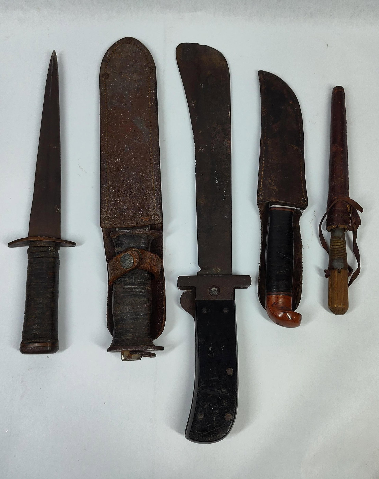 An Assortment of WWII Era US Military and Private Purchase Edged Weapons including a Case M3 Trench (1 of 4)