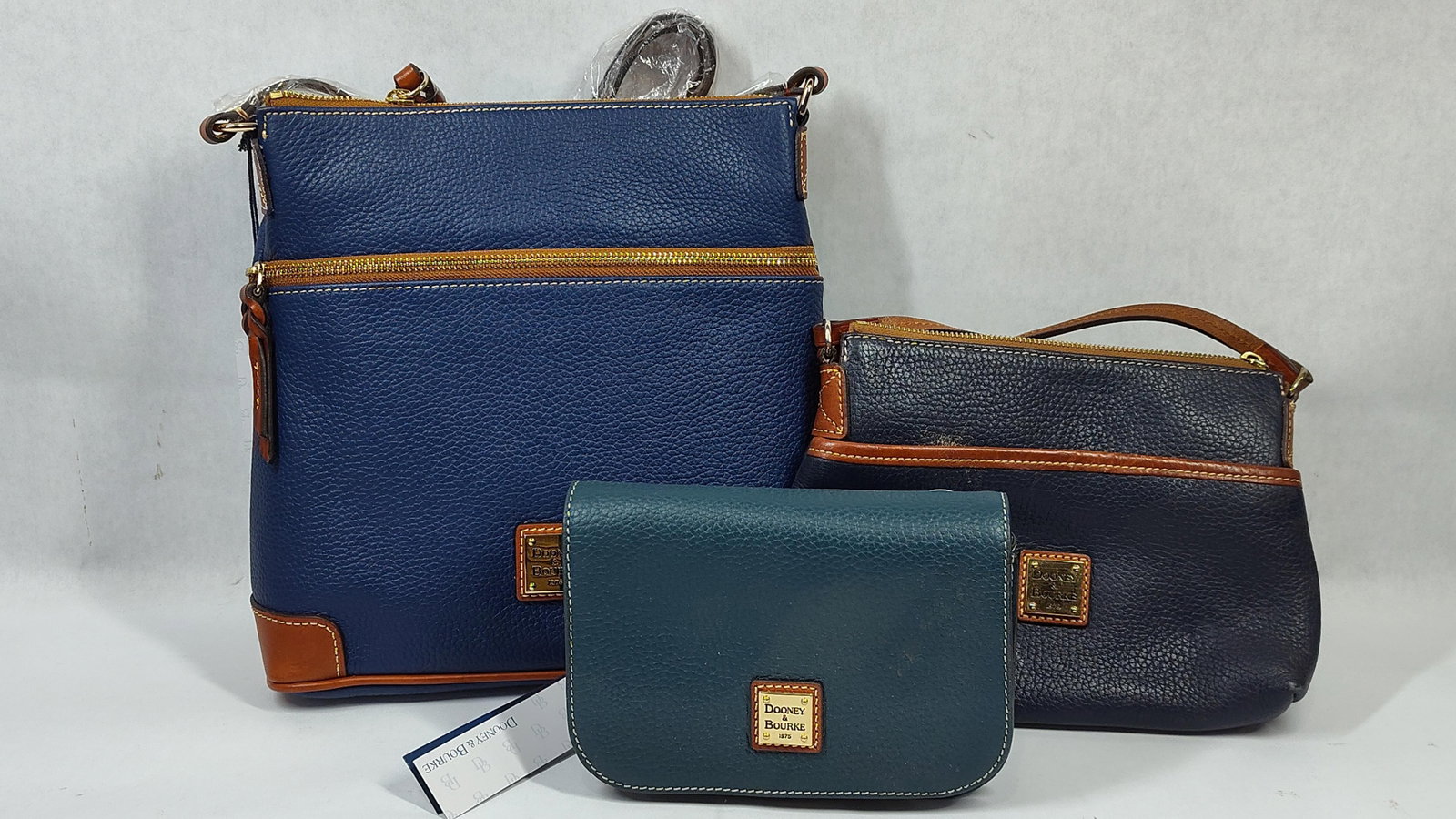 A Trio of Dooney & Bourke Pebble Grain Leather Crossbody Bags and Accessories (1 of 8)