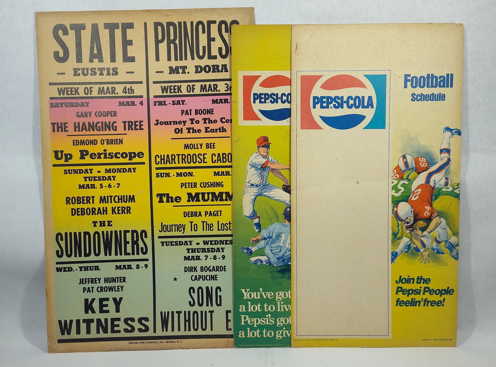A Trio ofAdvertising Broadsides Including Pepsi-Cola Sports Schedules and Florida Movie Theater: This lot features threepaper advertising posters and schedule broadsides. The group includes one double-theater movie broadside and two Pepsi-Cola sports schedule signs. The first item is a movie thea