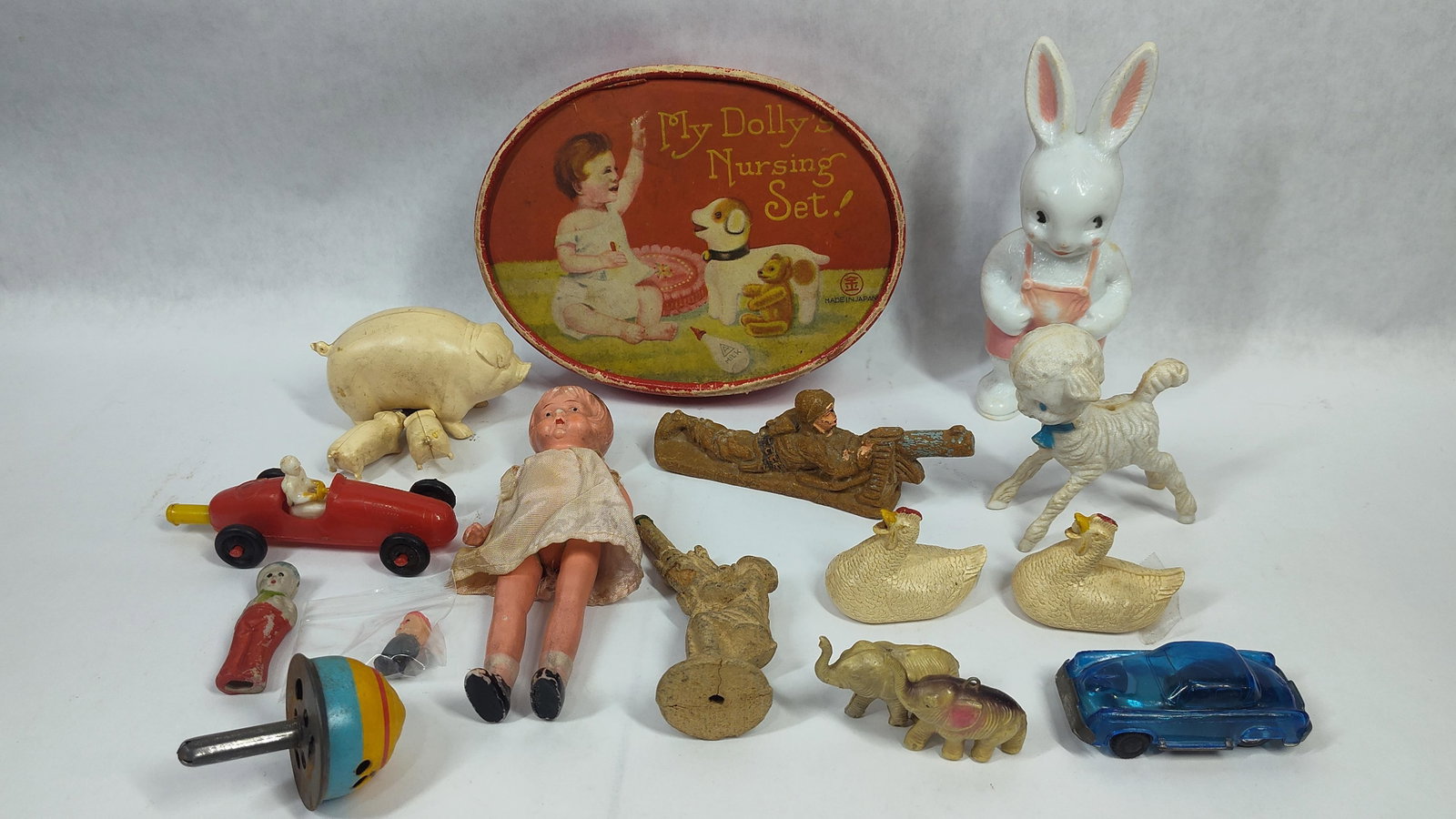 Toys and Novelties Including My Dollys Nursing Set: This lot features an assortment oftoys and novelties produced from various materials including celluloid, plastic, composition, and metal. The center piece is a My Dollys Nursing Set in its original o