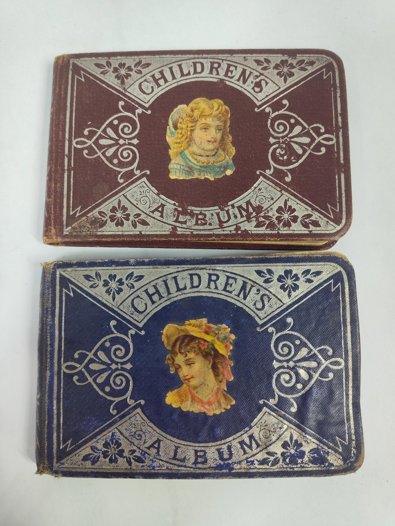 A Pair of Victorian Children's Autograph Albums. Chromolithograph Onlays. Circa 1879-1881. (1 of 2)