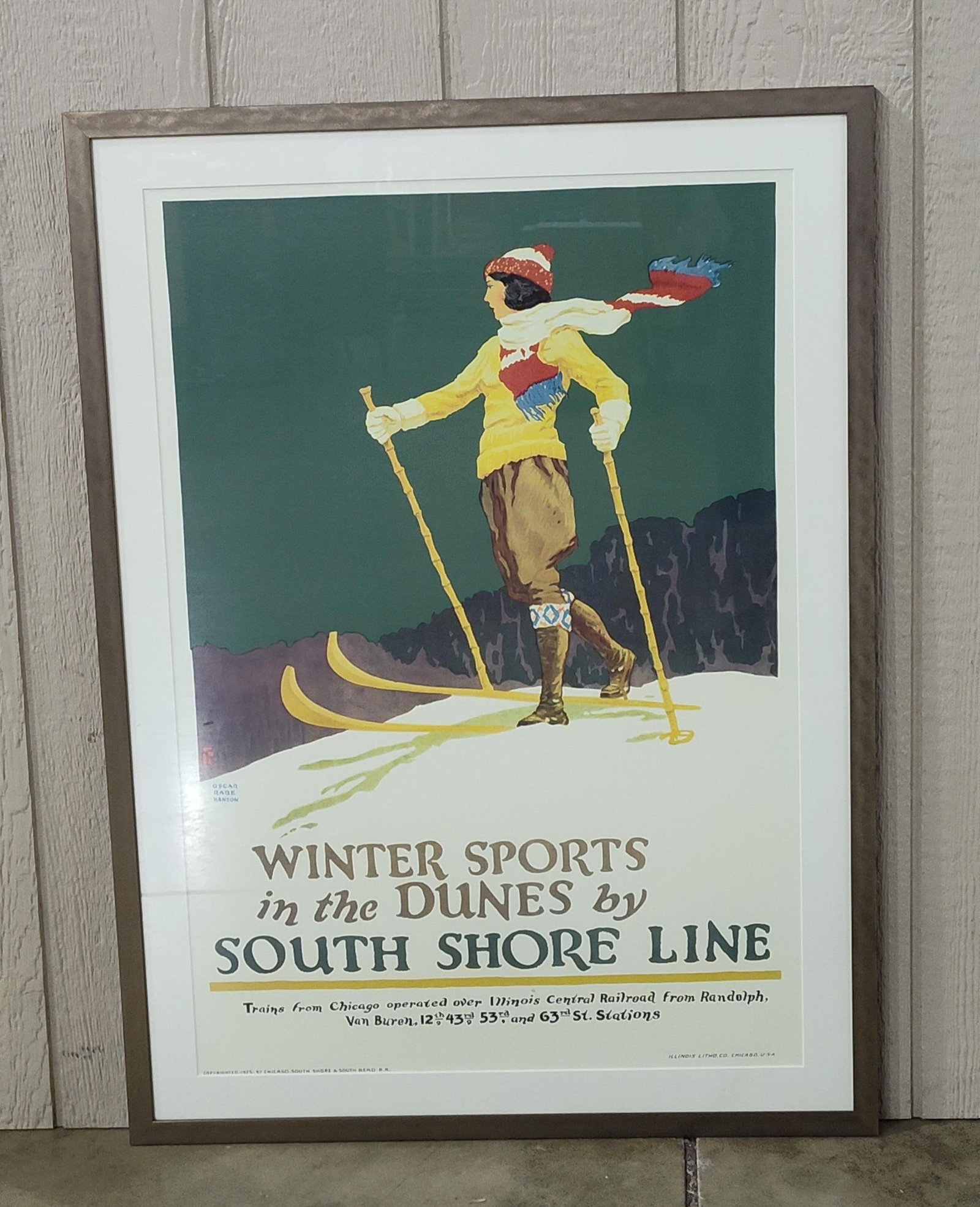 Oscar Rabe Hanson, Winter Sports in the Dunes by South Shore Line Lithographic Poster (Signed): This framed lithographic travel poster is titled Winter Sports in the Dunes by South Shore Line. The graphic design, executed in an Art Deco style, features a woman in 1920s winter sportswear cross-co