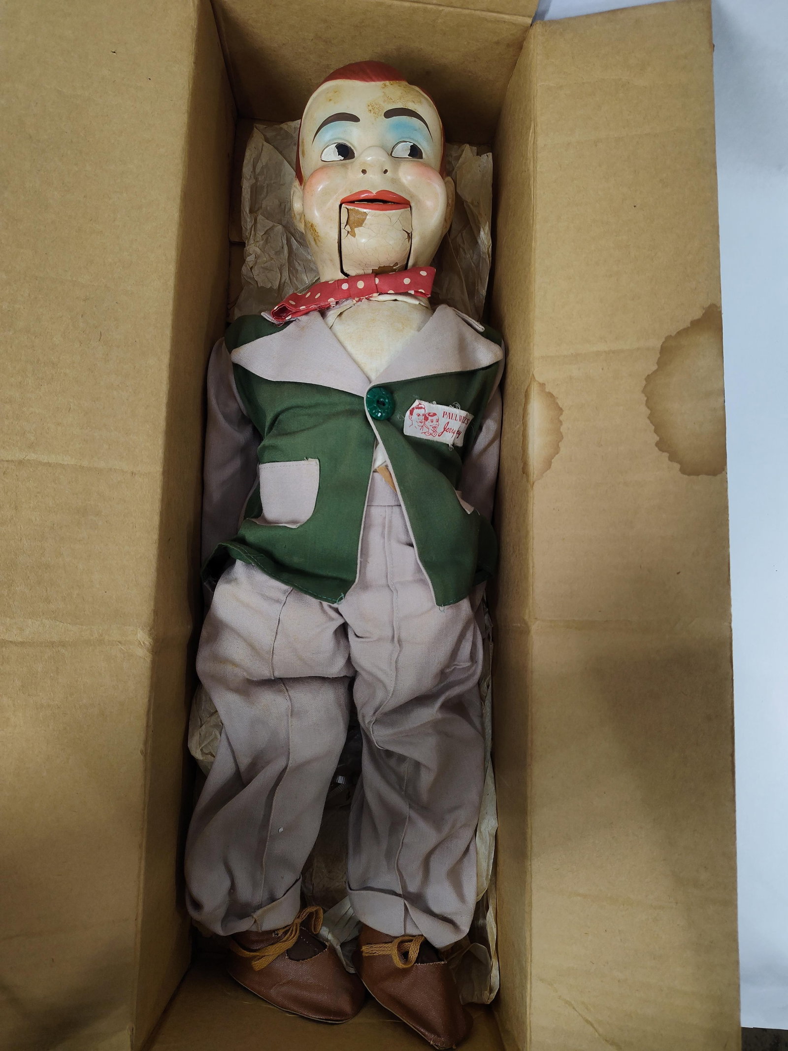 Juro Novelty Co. Jerry Mahoney Ventriloquist Dummy with Original Box: Produced by Juro Novelty Co. of New York, this ventriloquist dummy depicts Paul Winchell's character Jerry Mahoney. The dummy is constructed with a painted composition head, hands, and feet attached t
