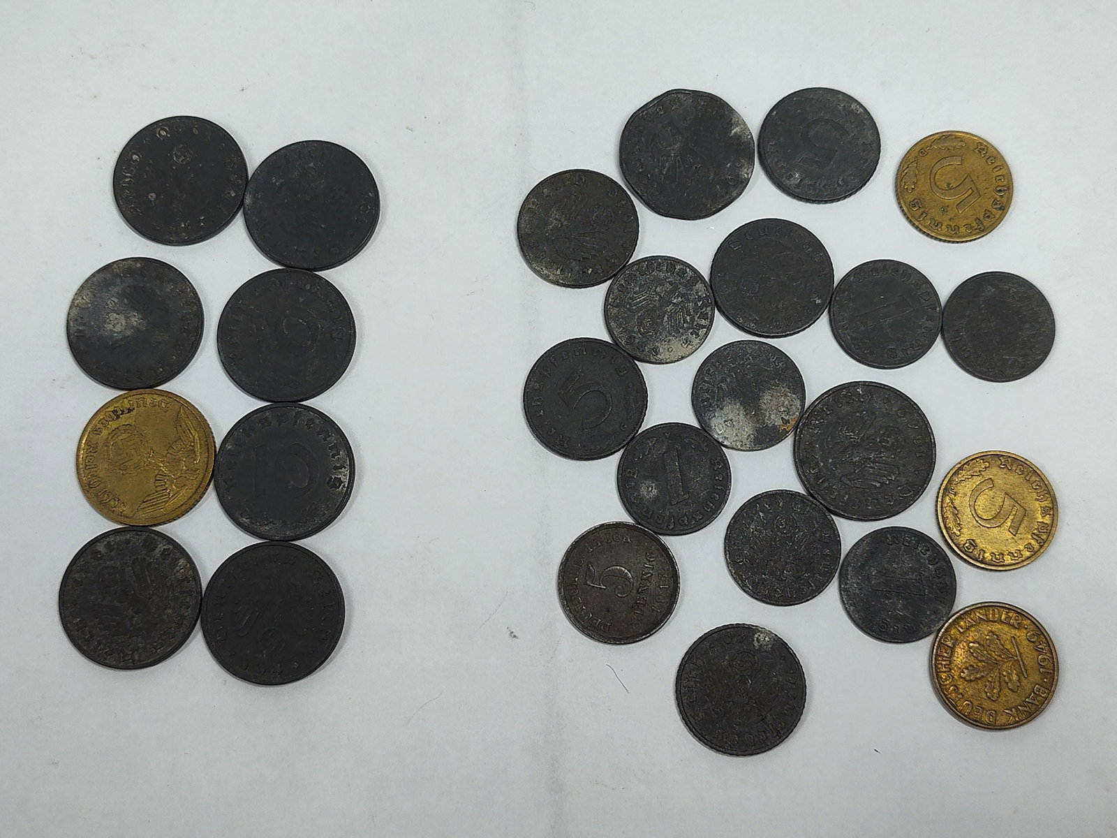 A Group of German Third Reich and Post-War Base Metal Coins: This collection consists of several German coins from the mid-20th century. The assembly primarily comprises zinc-composition issues from the Third Reich era, including 1, 5, and 10 Reichspfennig deno
