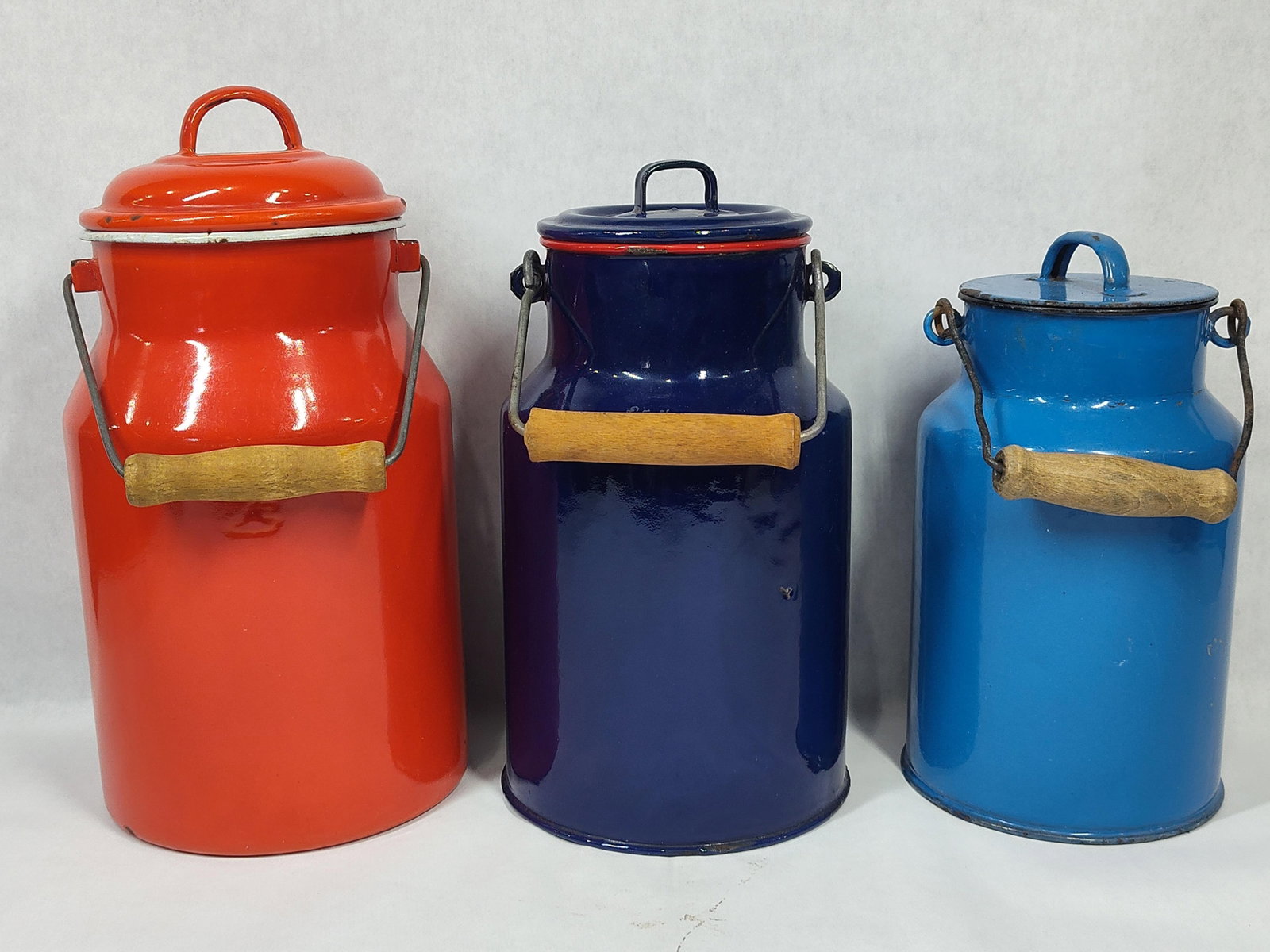 A Trio ofNesting Milk Cans with Wooden Grips (1 of 3)