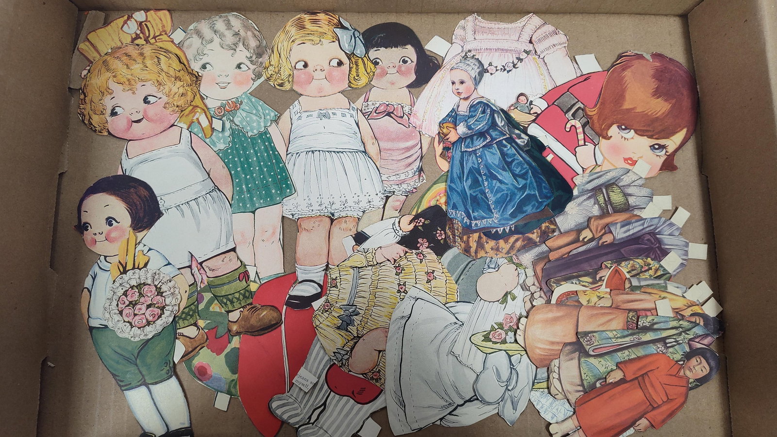 An Assortment ofLithographed Paper Dolls and Clothing in the Style of Grace Drayton (1 of 2)