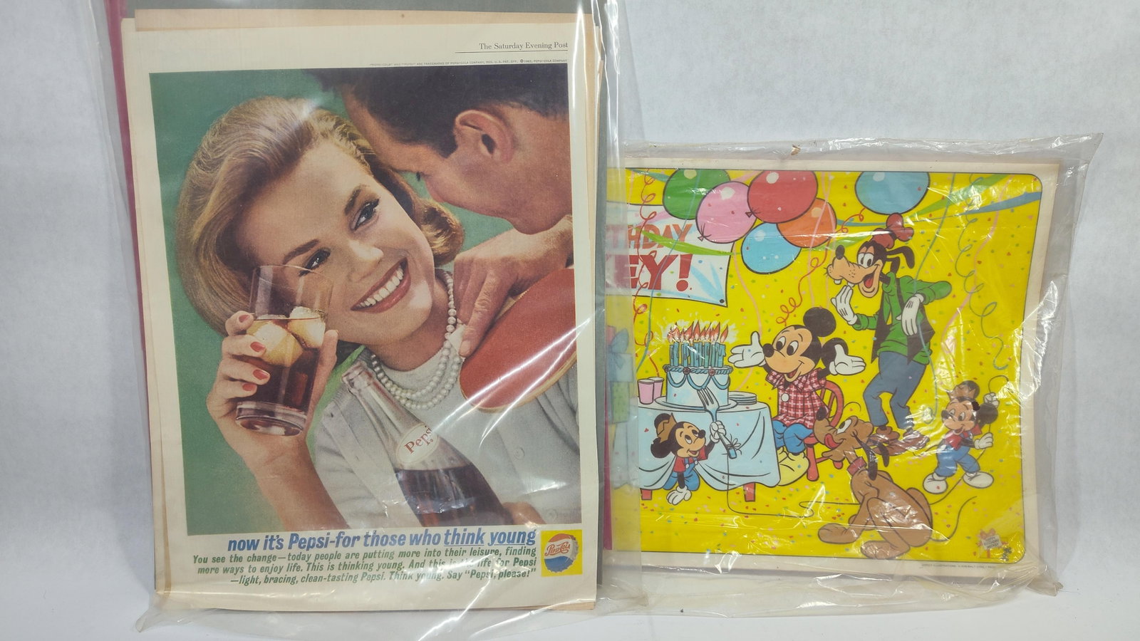 Pepsi-Cola Advertising Tear Sheets and Disney Promotional Placemats: paper ephemera featuring Pepsi-Cola advertising campaigns and Disney promotional materials spanning from the 1940s through the late 1970s. The assortment includes several full-page color magazine adve