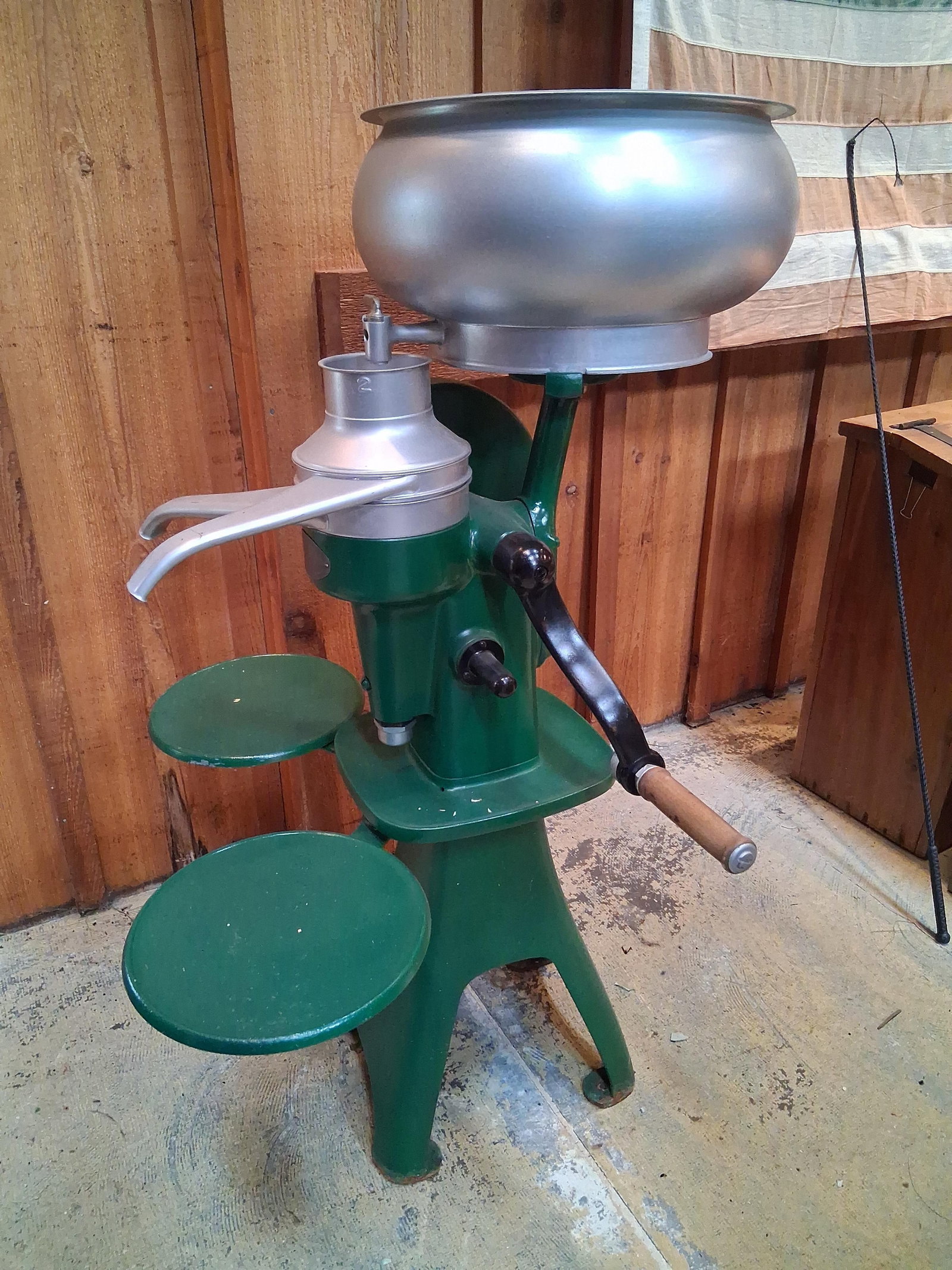 McCormick-Deering Hand-Crank Cream Separator: 29 in to top of horn. A vintage McCormick-Deering hand-cranked cream separator manufactured by the International Harvester Company of Chicago, Illinois. The machine is constructed with a heavy cast-ir