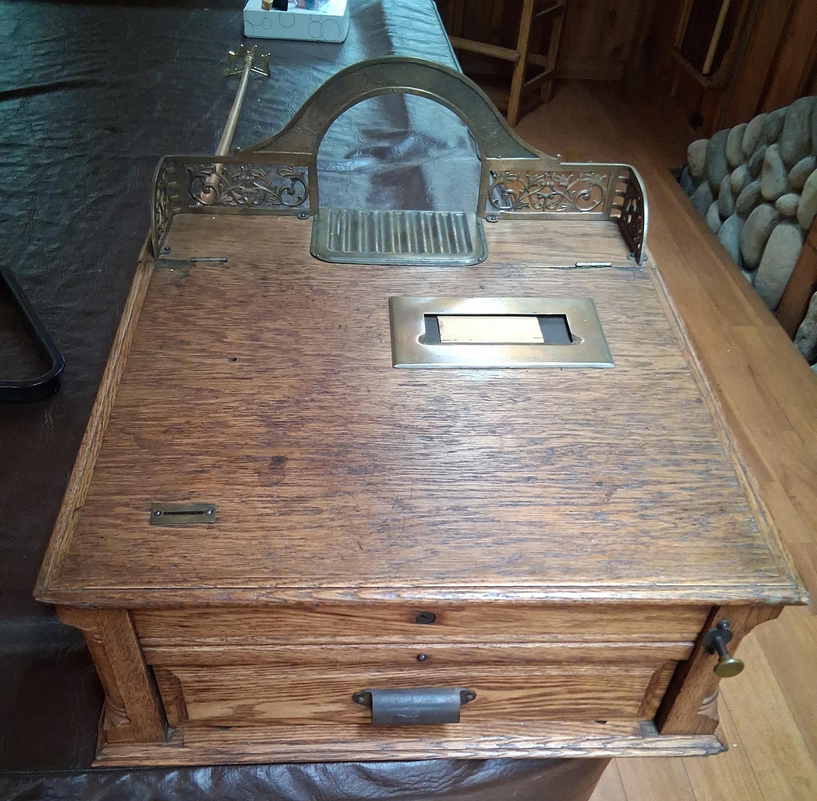 The Peck Autographic Cash Register: This antique autographic cash register was manufactured by The Peck Cash Register Co. of Syracuse, New York. The cabinet is constructed of quartersawn oak featuring paneled sides and a molded base.