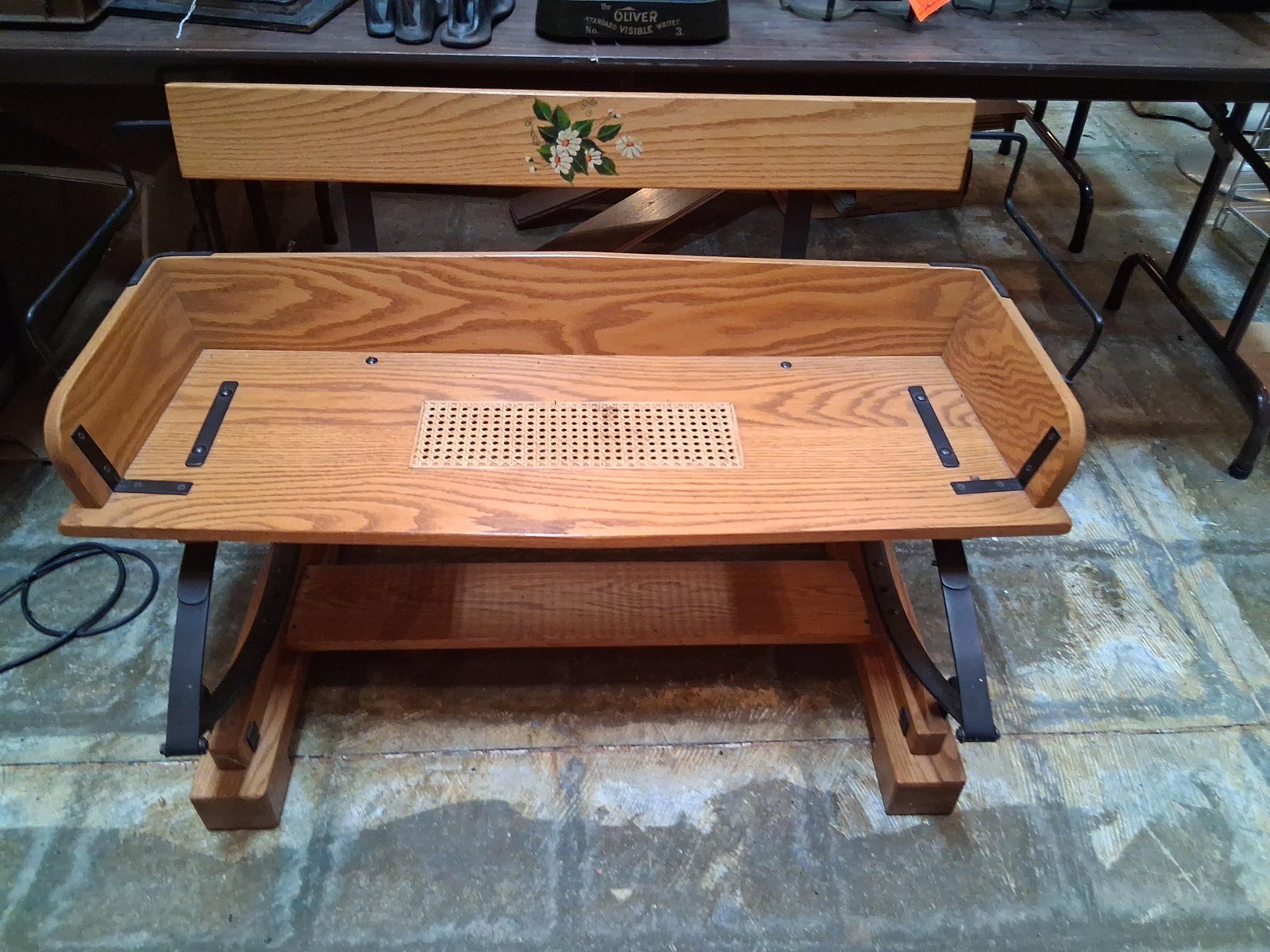 Oak Buckboard Bench w/ Leaf Spring & Caned Seat: This oak hall bench is designed in the style of a 19th-century horse-drawn buckboard wagon or buggy seat. The item is constructed from solid oak with a prominent grain and a honey-toned clear finish. 