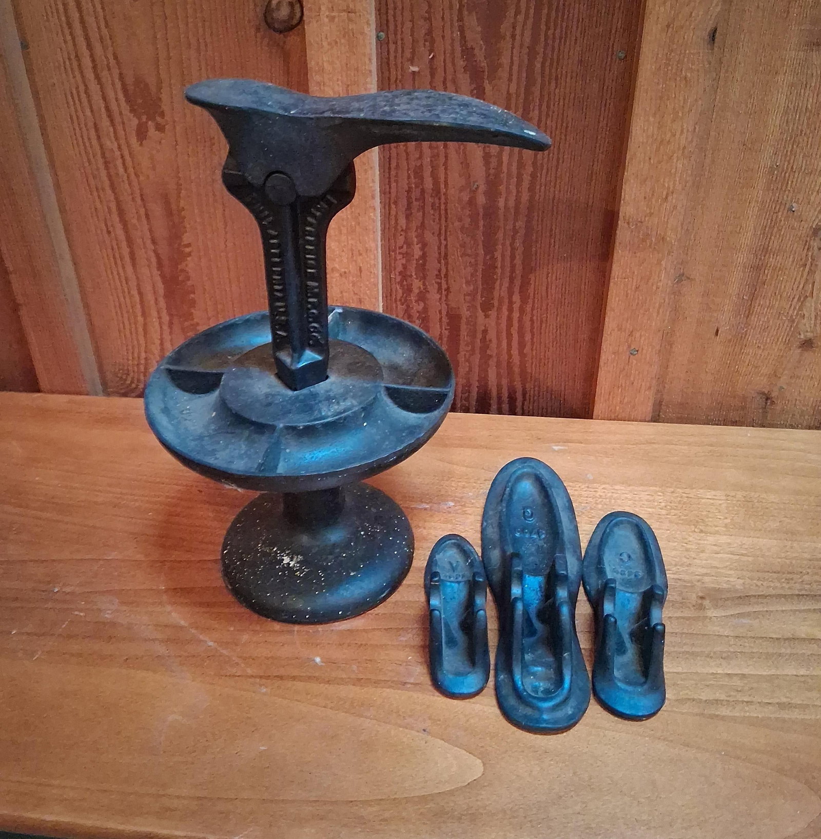 Enterprise Mfg Co Cast Iron Cobbler Stand & Lasts: Antique cast iron cobbler shoe repair stand manufactured by the Enterprise Manufacturing Company of Philadelphia, Pennsylvania. This set consists of a heavy pedestal base with an integrated circular