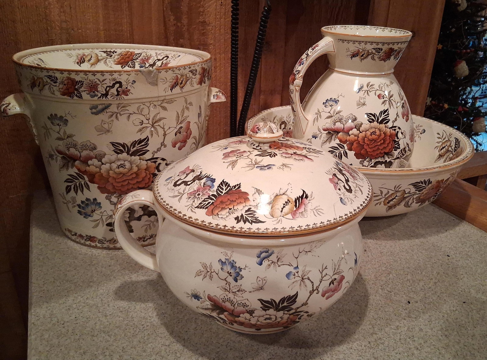 Villeroy & Boch Nelly Earthenware Washroom Set: This grouping of washroom ceramics is attributed to Villeroy and Boch in the Nelly pattern, dating to the late 19th century. The set is constructed from glazed earthenware and features a multi-color