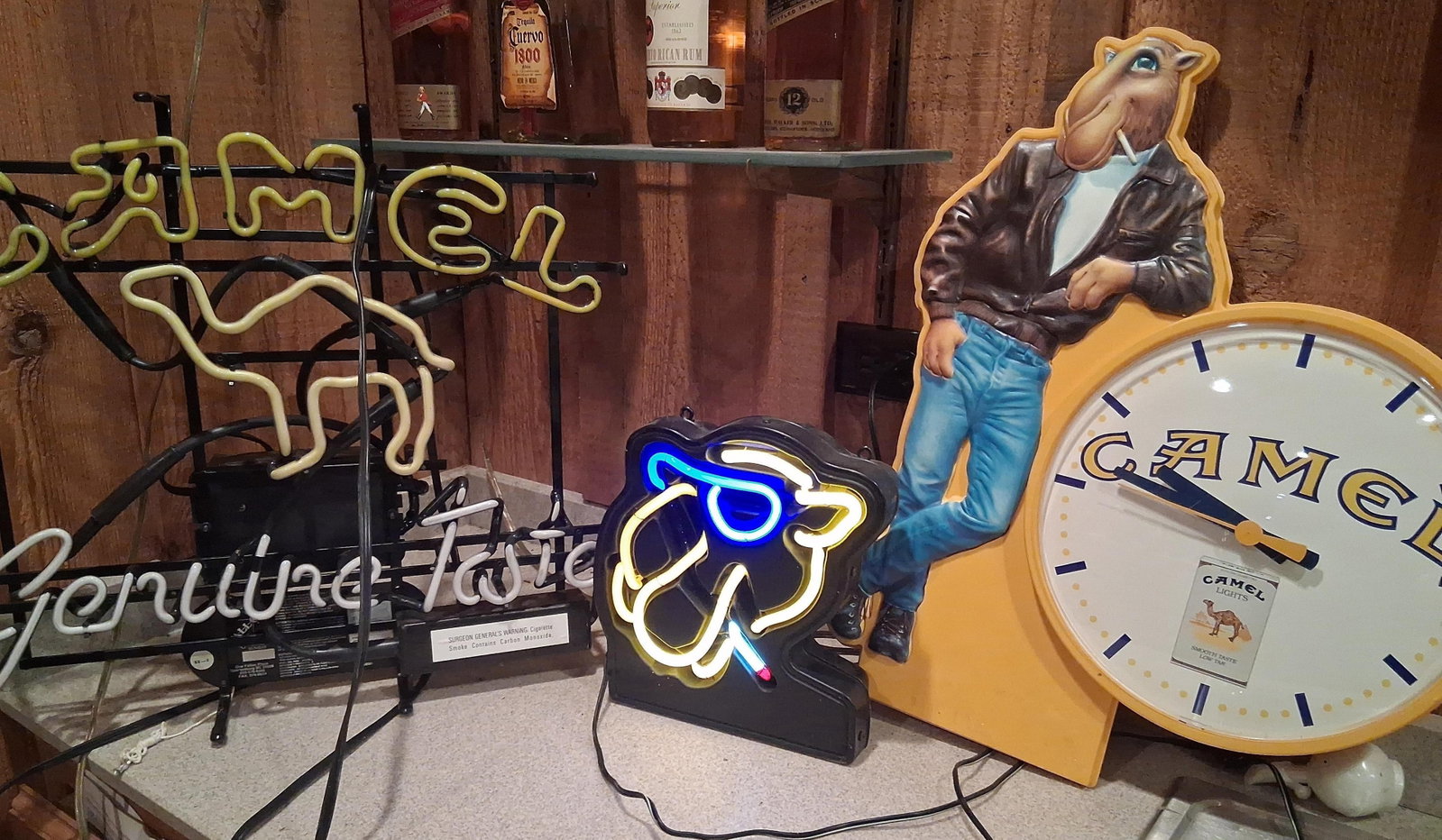Joe Camel Advertising: 2 Neon Signs & Wall Clock: Large Camel neon is not working. other work well. A trio of vintage tobacco advertising items featuring the Joe Camel mascot character produced for the R.J. Reynolds Tobacco Company. The collection