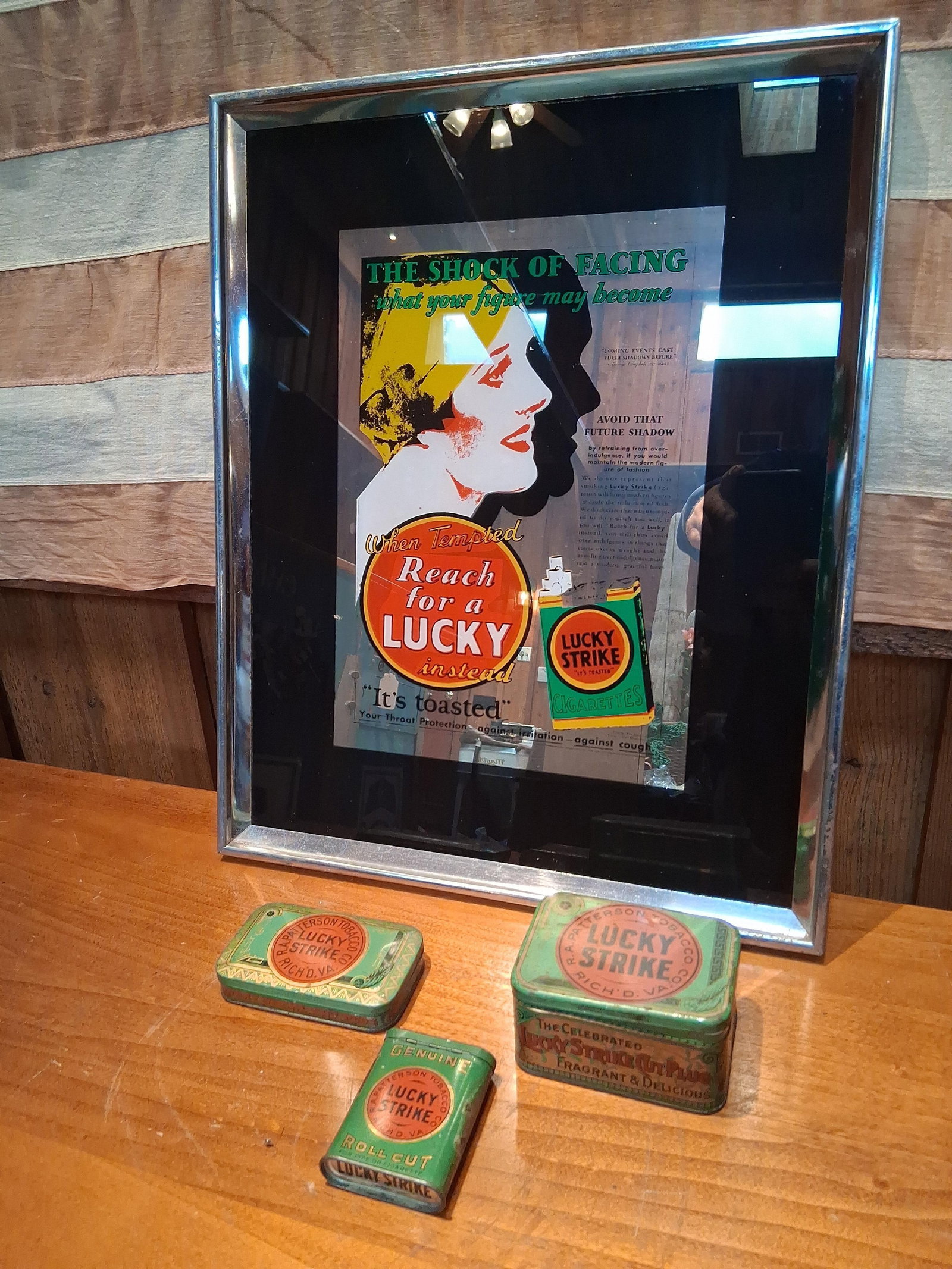 Lucky Strike Tobacco Advertising Mirror & Tins: This collection of Lucky Strike brand advertising memorabilia includes a framed advertising mirror and three lithographed tobacco tins. The framed mirror features graphics from the famous 1929 Reach f