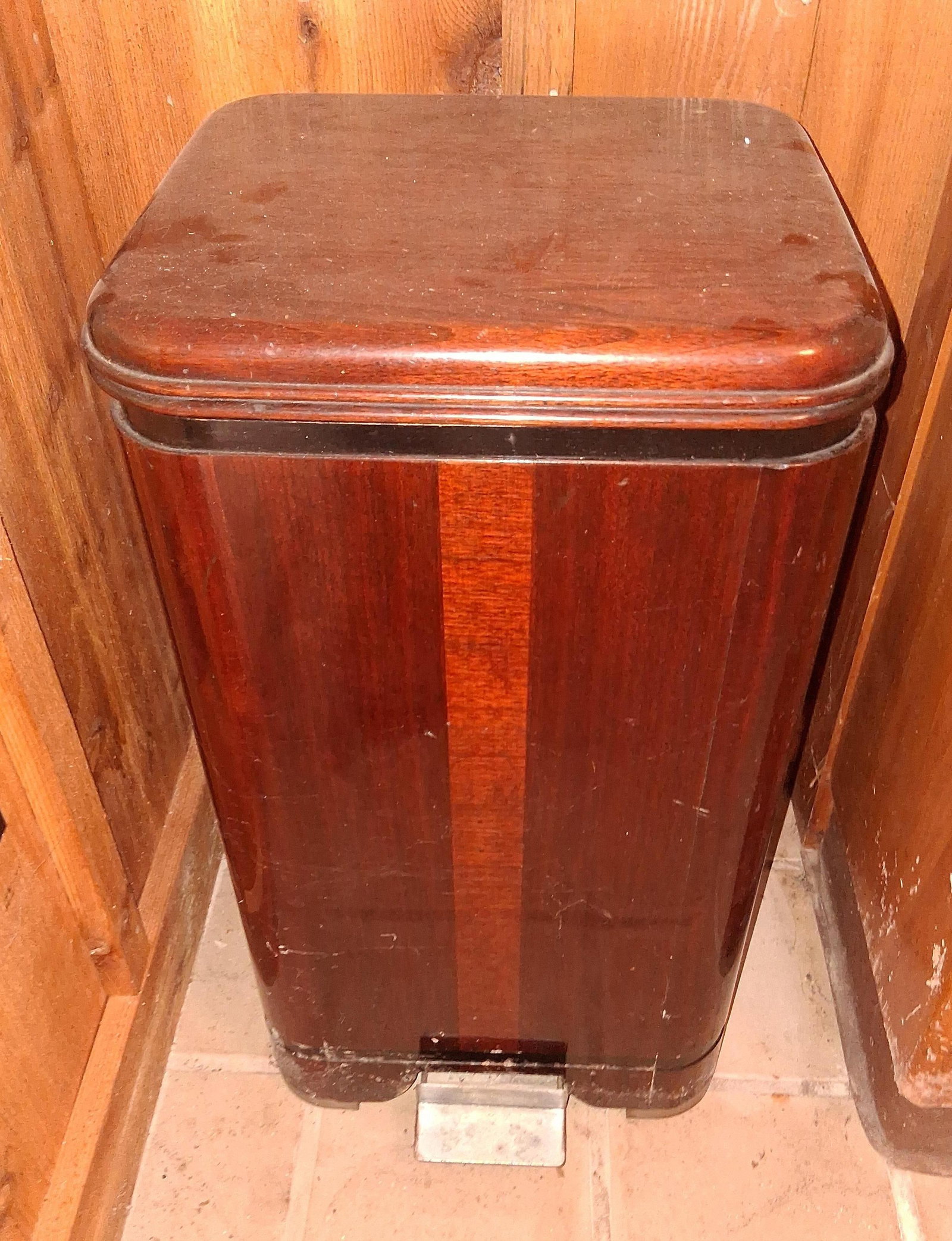 Milton Mfg. Art Deco Wood Veneer Step-On Trash Can: An Art Deco period step-on waste bin or hamper manufactured by the Milton Manufacturing Company of Two Rivers, Wisconsin. The exterior features a rectangular form with streamlined rounded corners,
