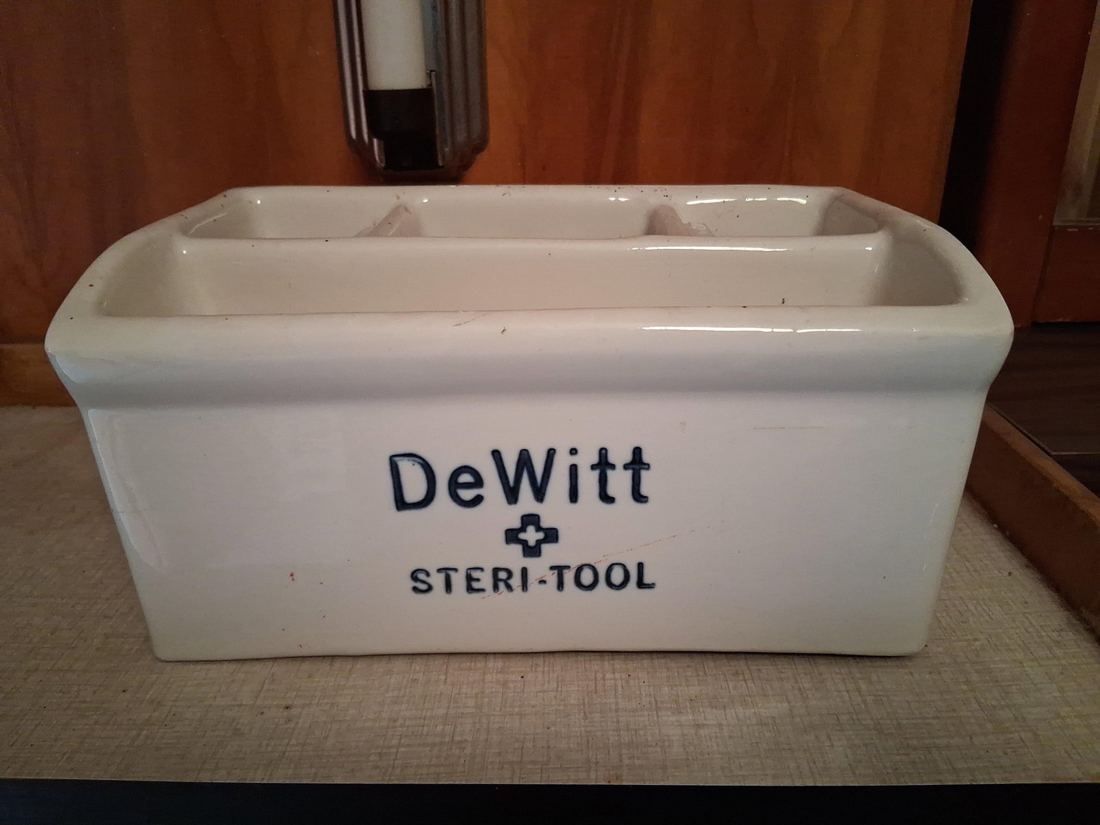 Vtg DeWitt Steri-Tool Porc. Barber Sterilizer Tray: This vintage sterilization tray is manufactured by DeWitt and is identified by the Steri-Tool brand name. The vessel is constructed of heavy-walled white glazed ceramic. The interior is divided into