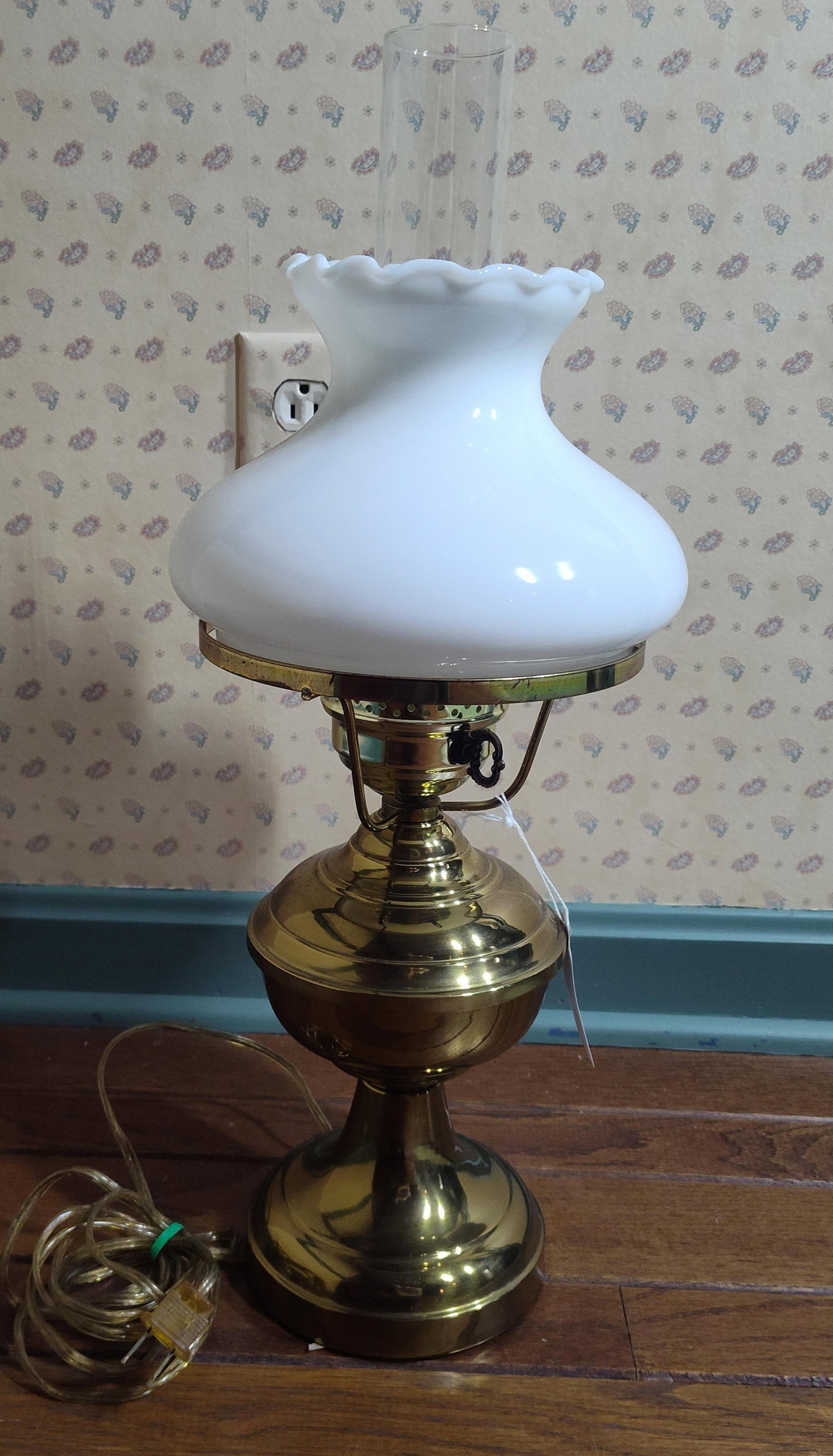 Vtg Brass-Toned Hurricane Lamp w/ Milk Glass Shade: This electric hurricane-style table lamp is designed in the tradition of late 19th-century central-draft oil lamps, such as those by Miller or Rayo. The lamp features a polished brass-toned metal base