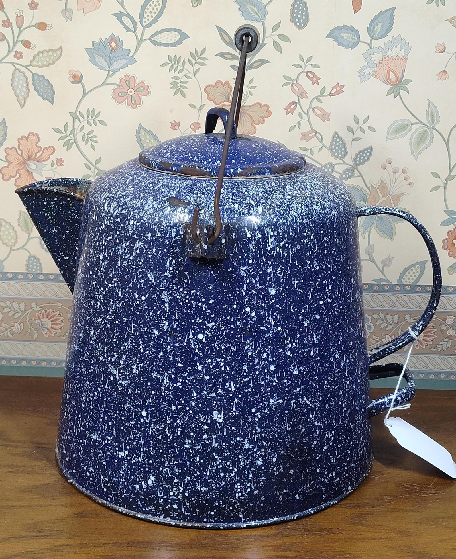 American Blue & White Speckled Enamel Coffee Pot: A large-capacity coffee pot or camping boiler featuring a blue and white speckled enamel finish over a steel body. The piece is designed in a tapered conical form and includes a fitted lid with a