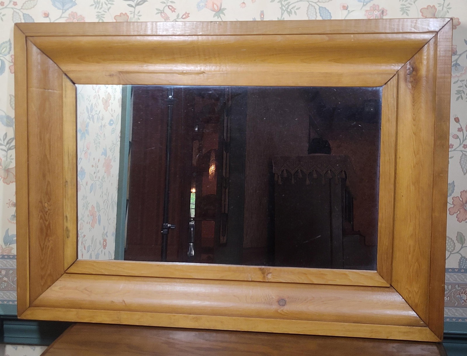 Pine Wall Mirror: 30.5 x 21.5. A large rectangular wall mirror featuring a wide, convex cushion-molded frame. The frame is constructed of solid knotty pine with a warm amber-toned finish that highlights the natural gra