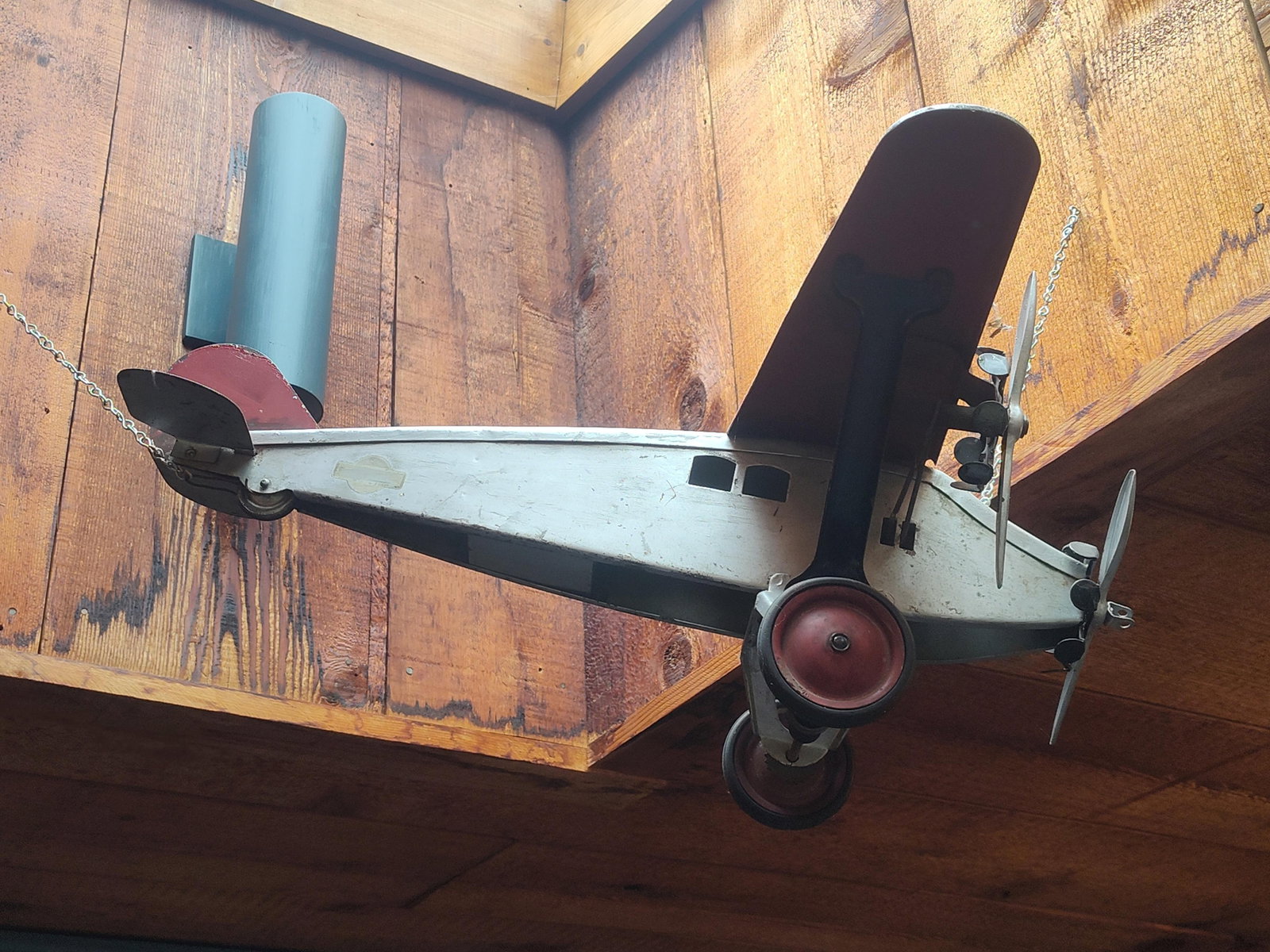 Steelcraft Boycraft Tri-Motor Airplane: Produced by Steelcraft under the Boycraft brand name, this is a vintage pressed steel toy modeled after a tri-motor transport aircraft of the late 1920s to early 1930s. The airplane features a high-wi