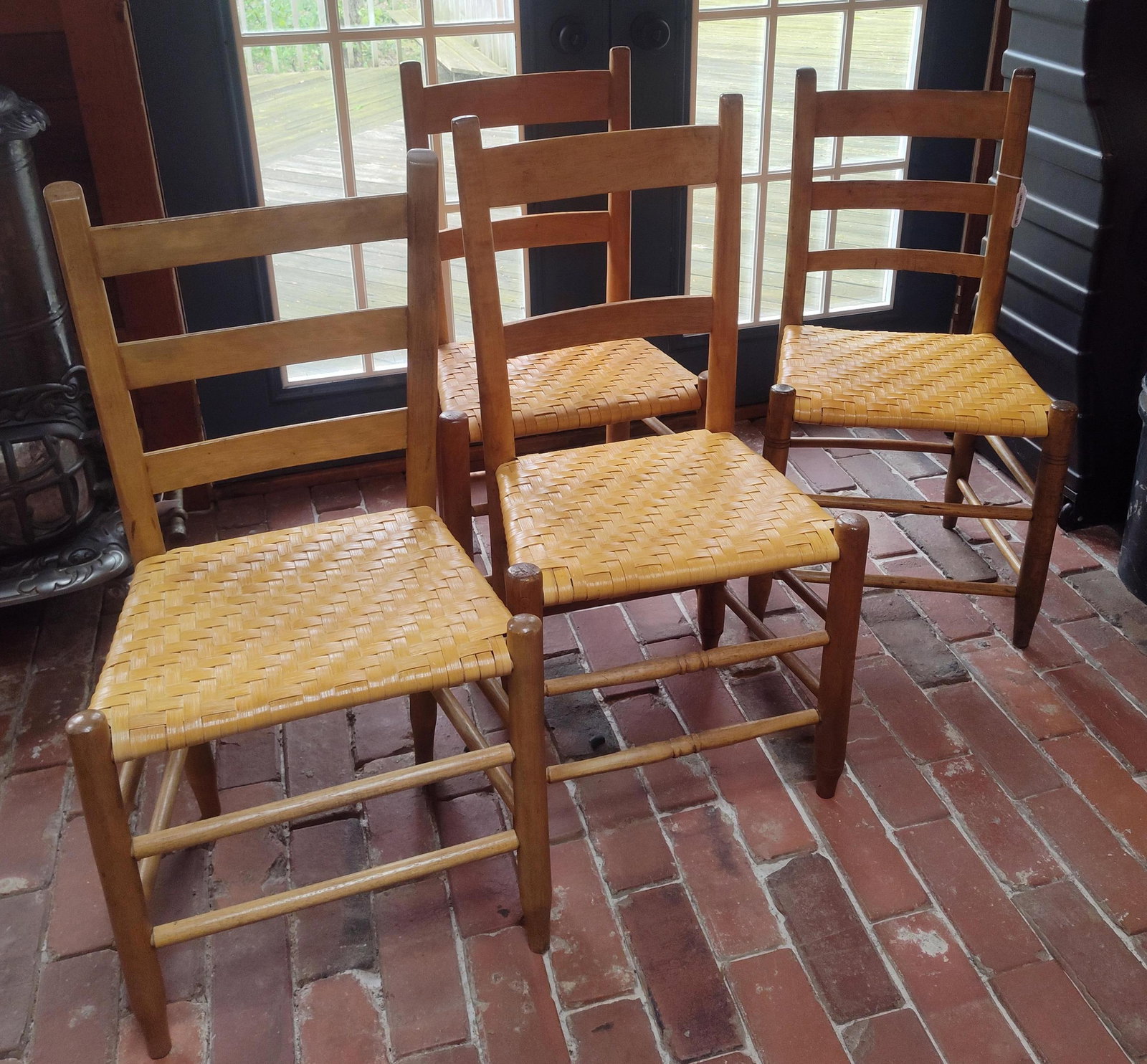 Set 4 Shaker Style Ladder Back Splint Side Chairs: This set of 4 side chairs is crafted in a traditional Shaker or Early American style. The frames are constructed from a light colored hardwood with a warm honey toned finish. Each chair features a