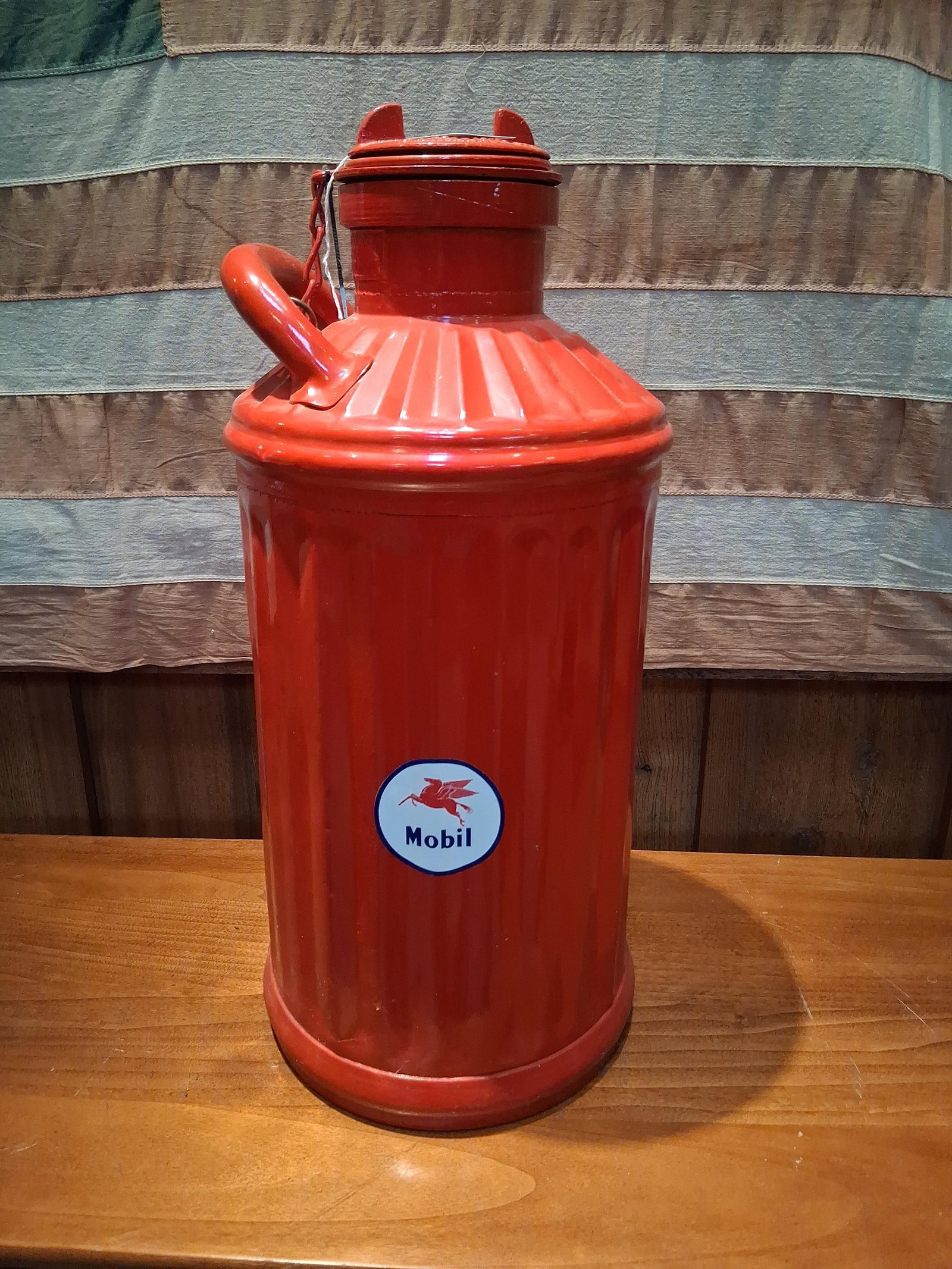 Davis Welding & Manufacturing Mobil Bulk Oil Can: A vintage bulk liquid delivery can manufactured by The Davis Welding & Manufacturing Co. of Cincinnati, Ohio. Constructed from heavy-gauge metal, the vessel was originally utilized for the transport