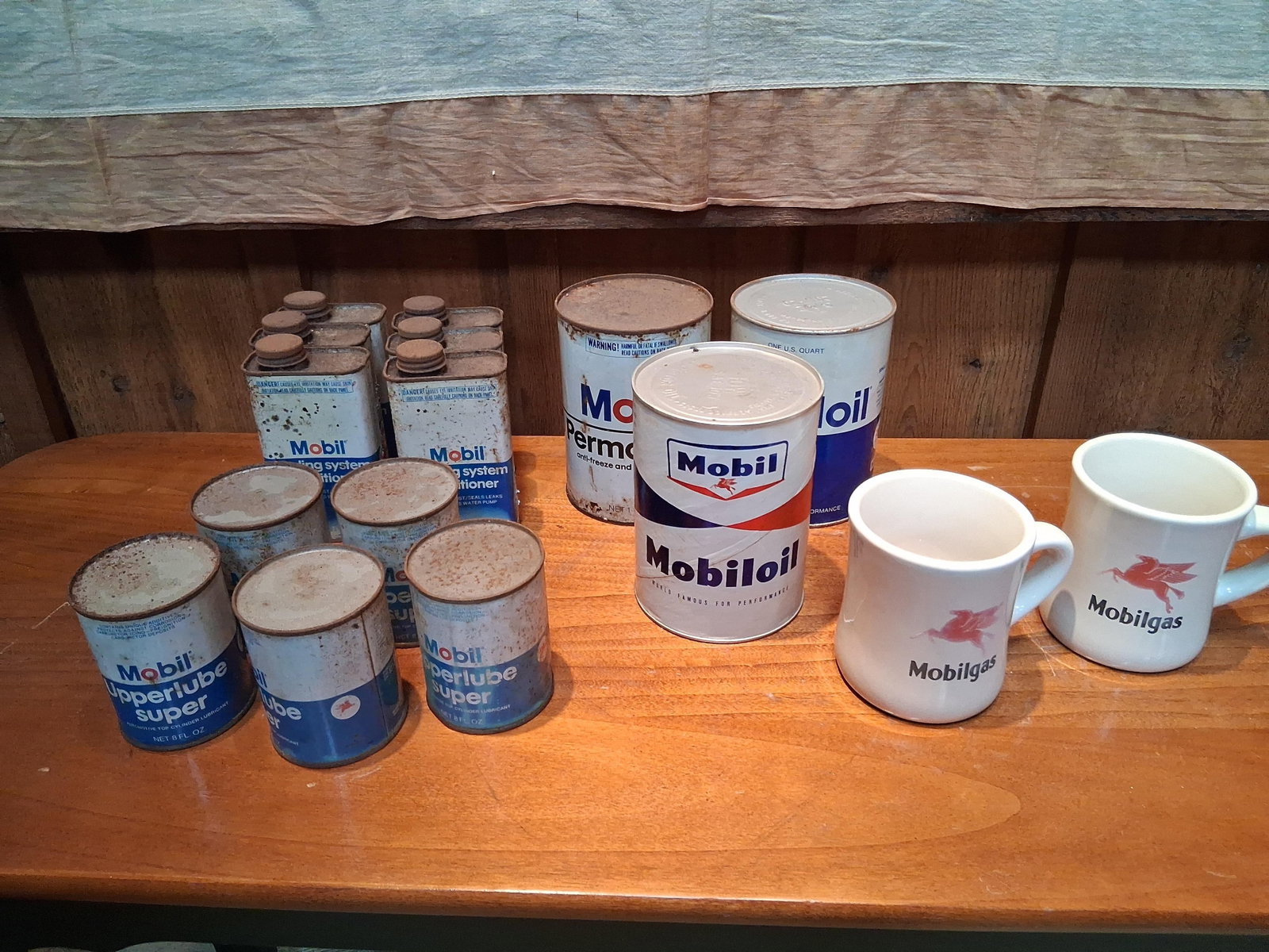 16 Vtg Mobil Automotive Products & Memorabilia: This collection consists of sixteen vintage Mobil branded automotive products and memorabilia items. The group features two white ceramic coffee mugs in a heavy restaurant-ware style, each decorated