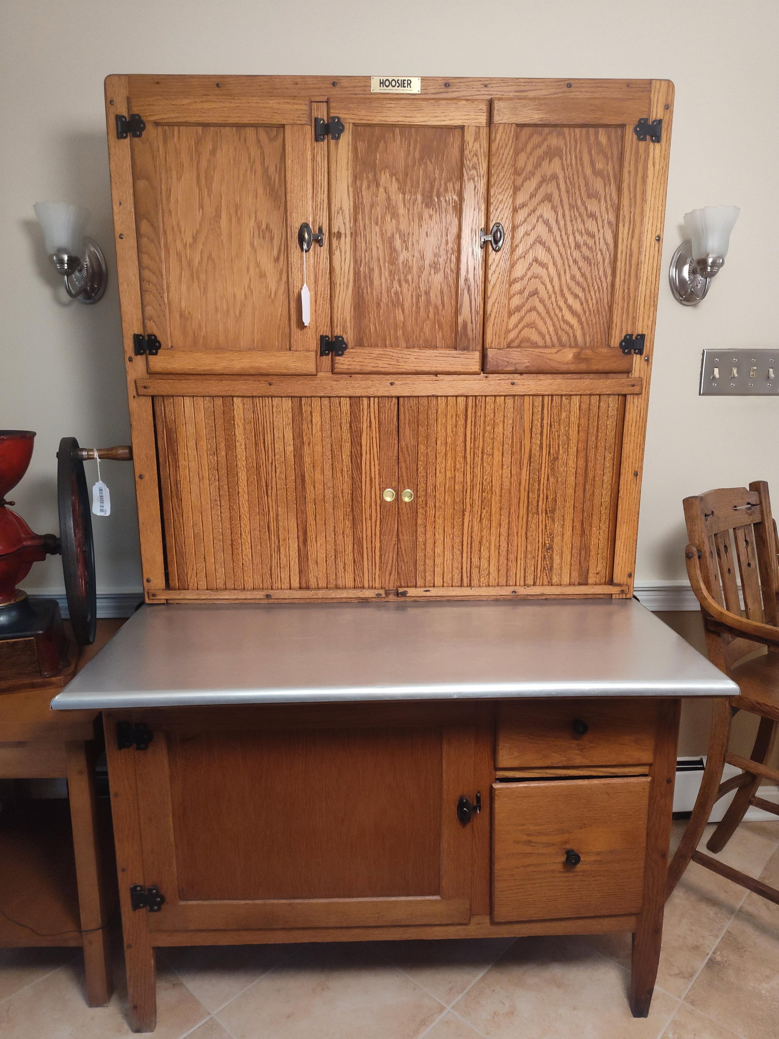 Hoosier Manufacturing Co. Two-Piece Oak Cabinet: 42x 70x 28. An antique two-piece oak kitchen cabinet manufactured by The Hoosier Manufacturing Co. of New Castle, Indiana. The piece is constructed of oak with a warm honey-toned finish and