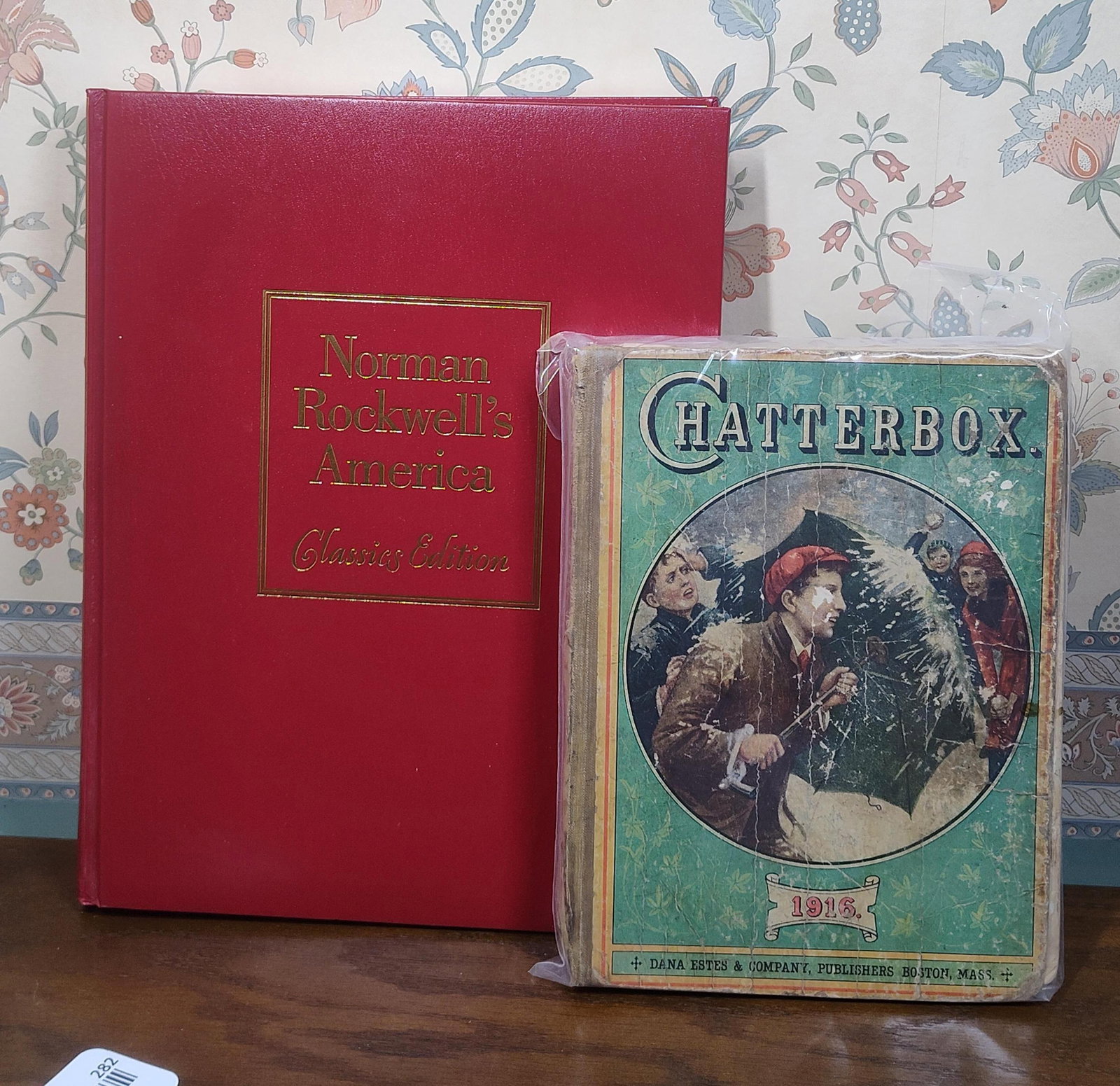 Norman Rockwell's America & Chatterbox 1916, Set: A lot of two volumes consisting of a large-format art book and an early 20th-century children's annual. The first volume is titled Norman Rockwell's America Classics Edition, bound in publisher's red