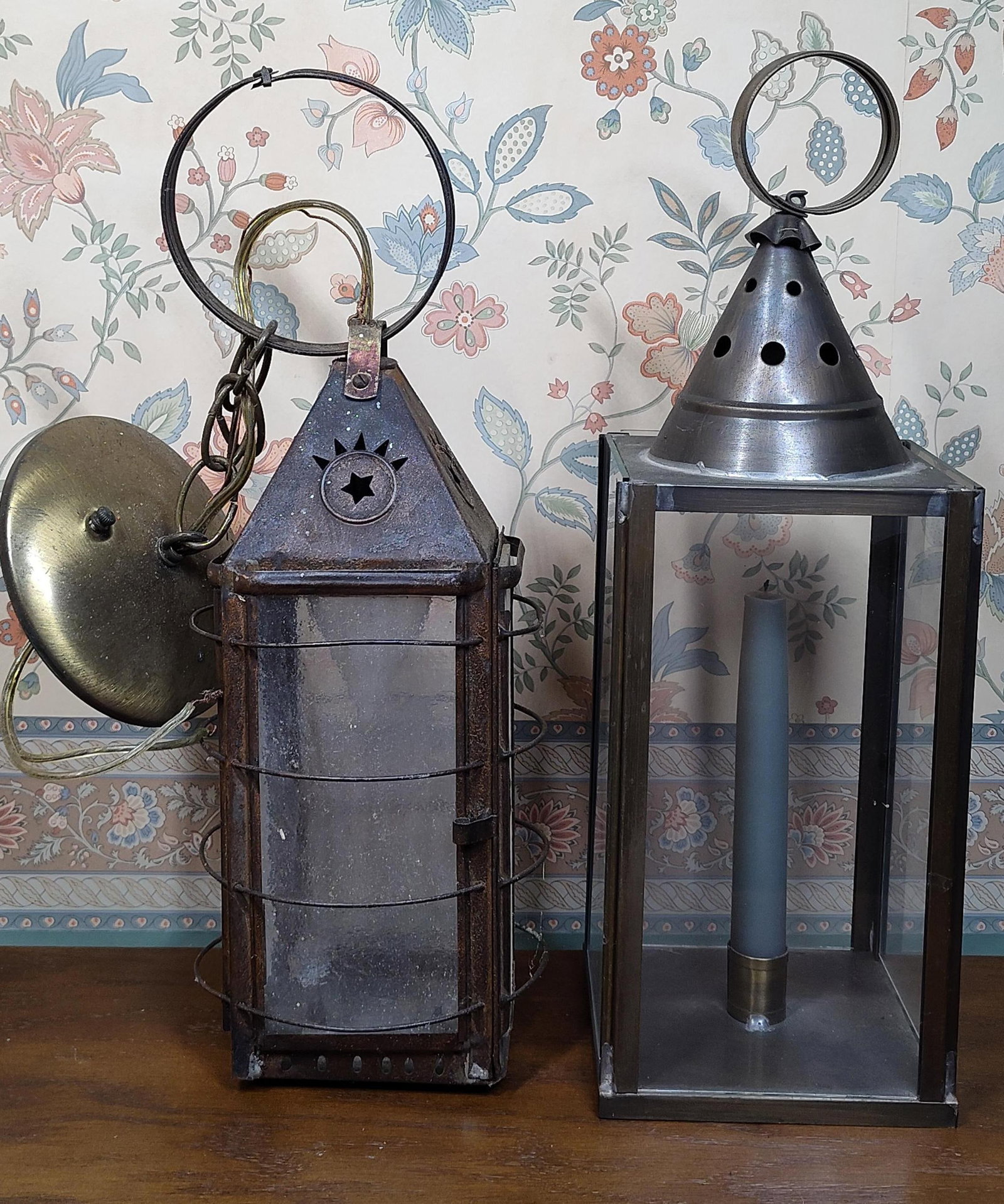 Electrified Rustic Sconce & Metal Candle Lantern: This lot features two lanterns of distinct styles and periods. The first is an electrified wall-mounted sconce designed in the style of 19th-century American candle lanterns, specifically resembling