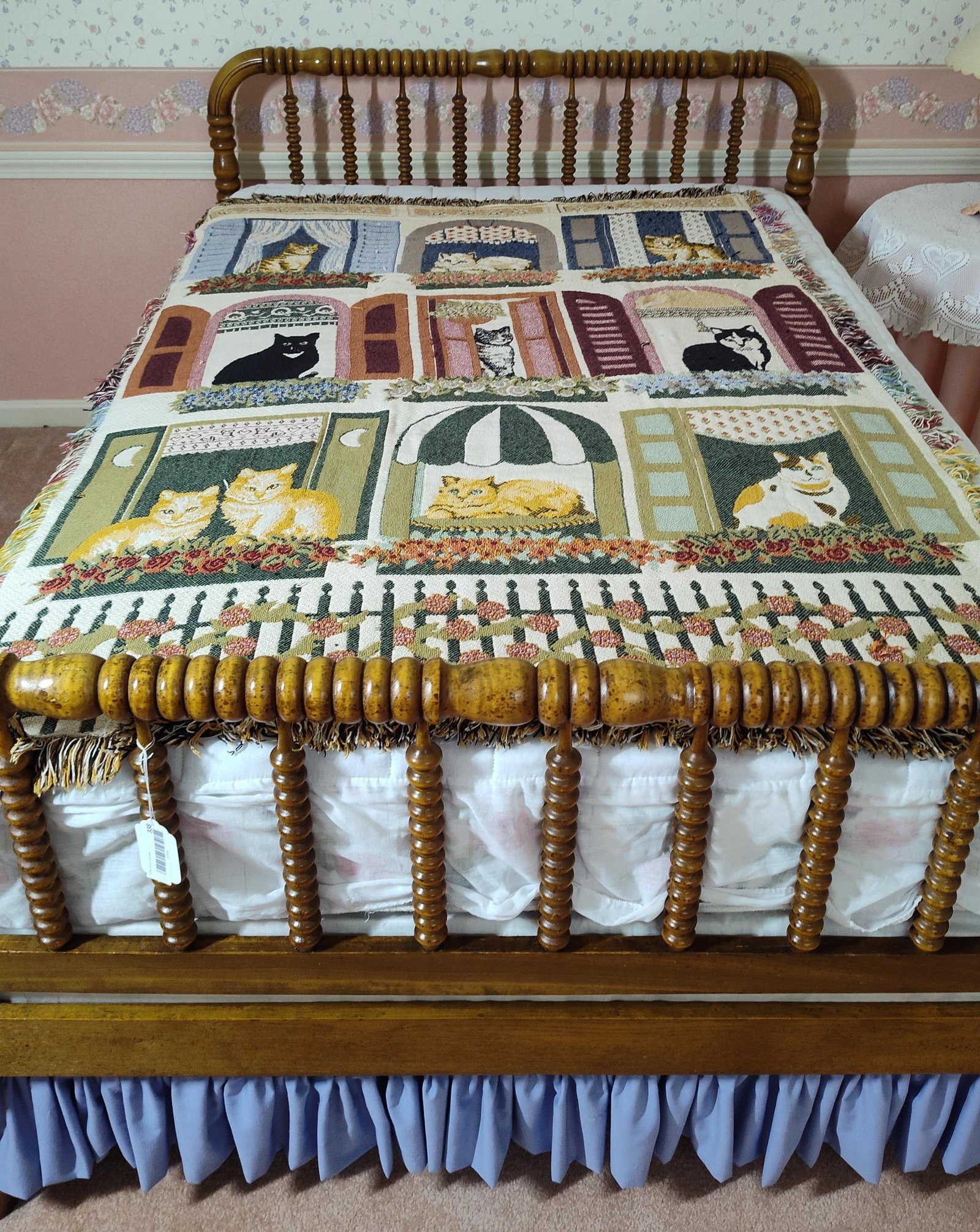 Jenny Lind Style Bed Frame & Cats Tapestry Throw: 72x 51. This lot includes a wooden bed frame and a decorative jacquard-woven tapestry throw. The bed frame is designed in the American Colonial Revival or Jenny Lind style, consisting of a headboard,