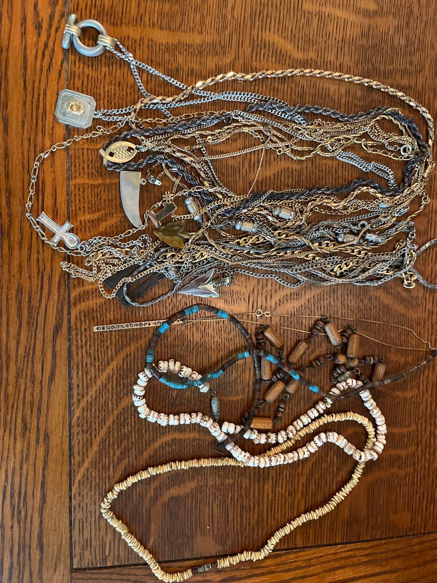 Metal & Beaded Necklaces w/ Pendants: An assortment of necklaces and pendants featuring a variety of styles, materials, and motifs. The collection includes numerous metal chains in both gold-toned and silver-toned finishes, with link styl