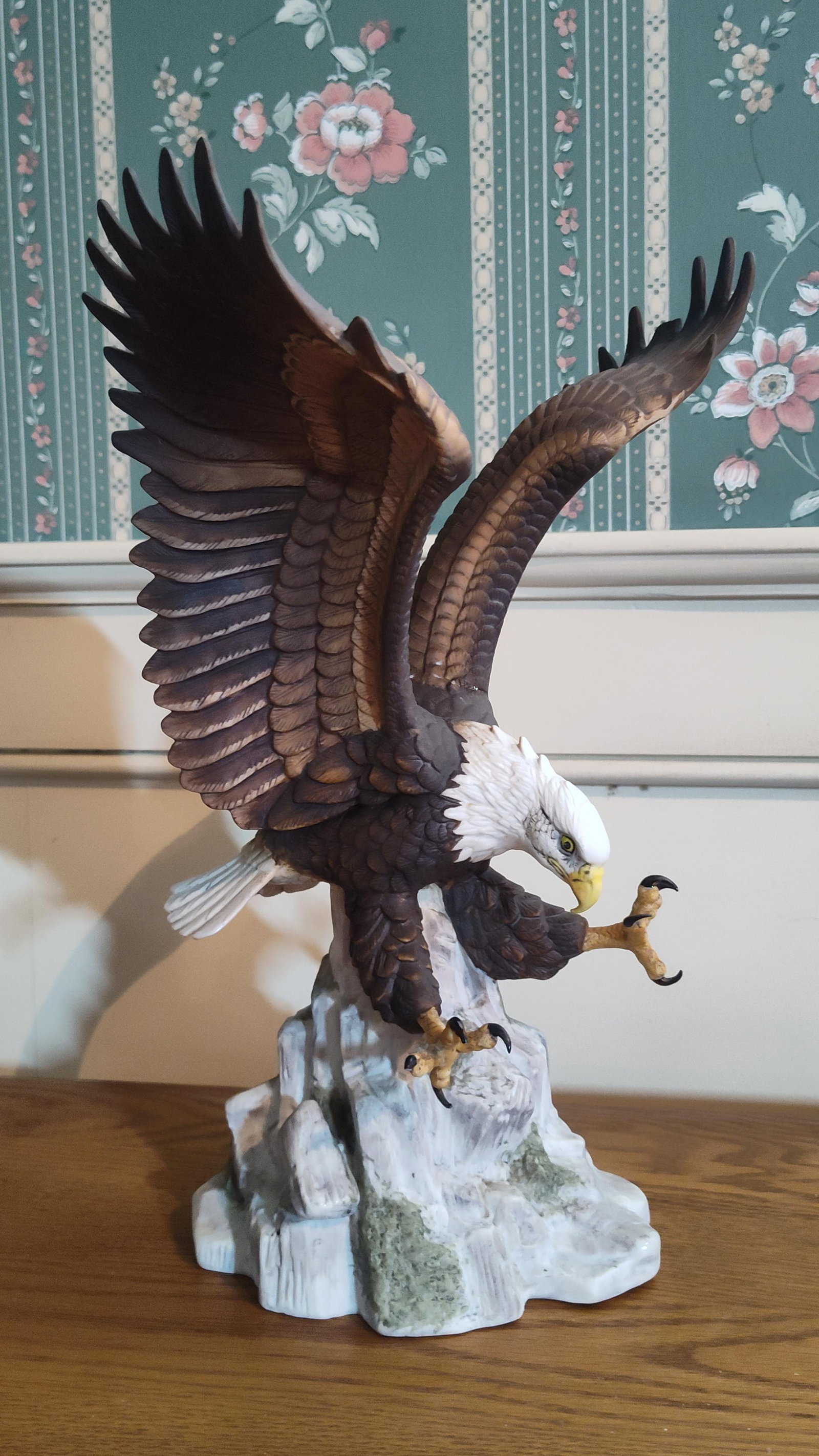 Stefani Porcelains Bald Eagle Bisque Figurine: A large hand-painted bisque porcelain figurine of a bald eagle by Stefani Porcelains. The eagle is captured in a dynamic, descending pose with widespread wings and extended talons as it prepares to la