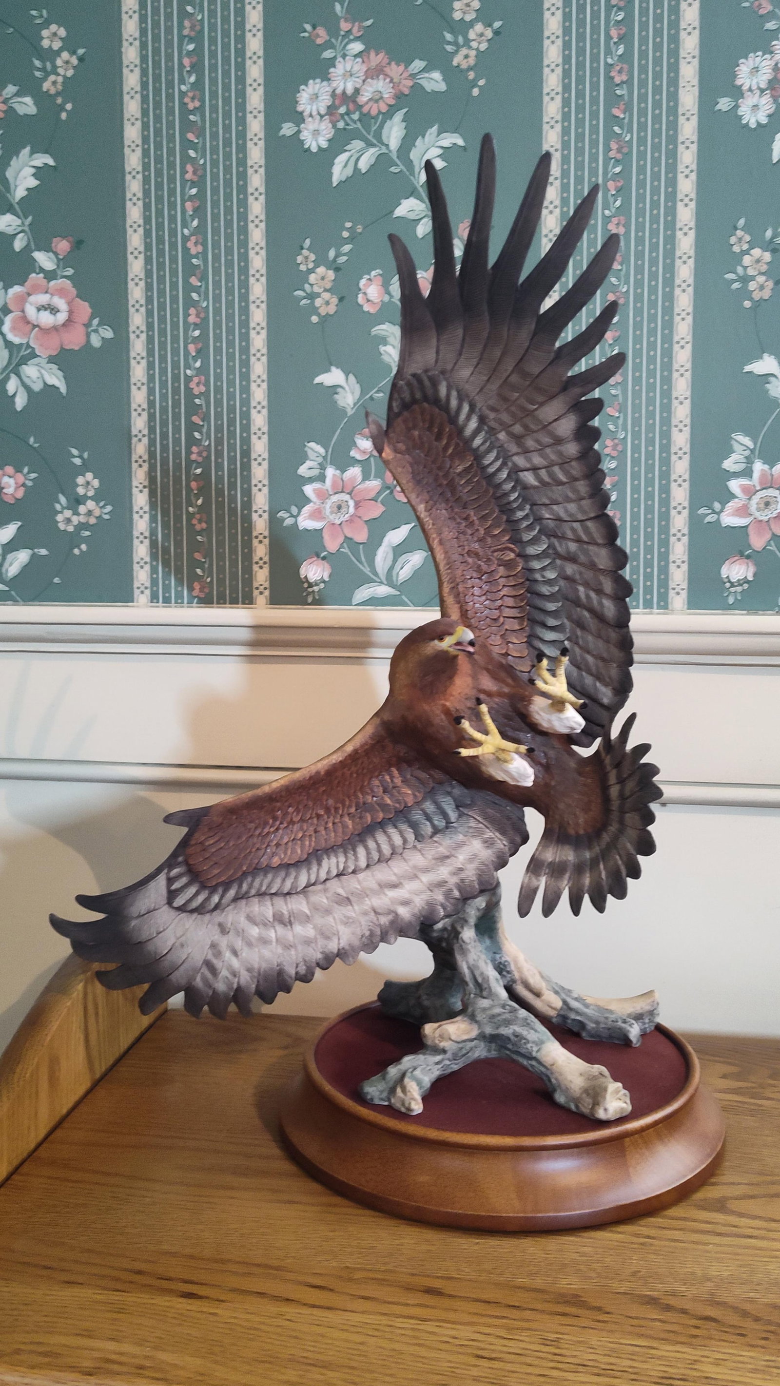 Franklin Mint 1988 Porc. Golden Eagle Figurine: This hand-painted bisque porcelain figurine depicts a golden eagle in a dynamic landing pose with outstretched wings and extended talons. Produced by The Franklin Mint, the sculpture features